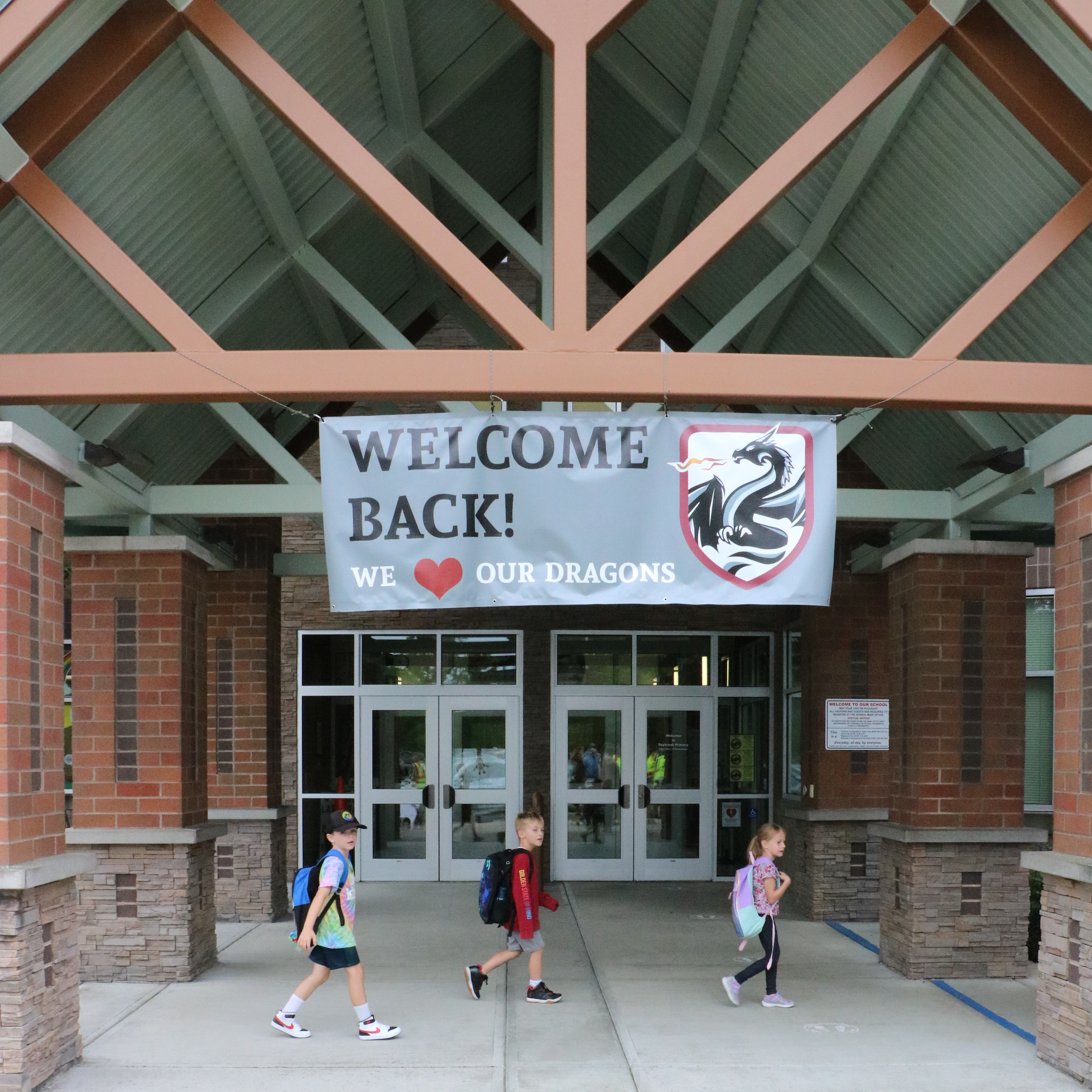 Students walk past the front entrance of Daybreak Primary School