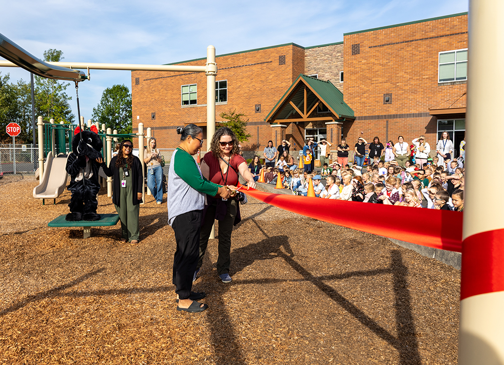 Ribbon cutting for new playground equipment