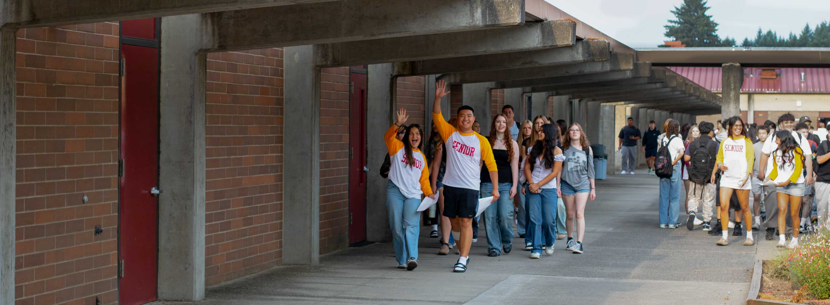 senior students wave hello
