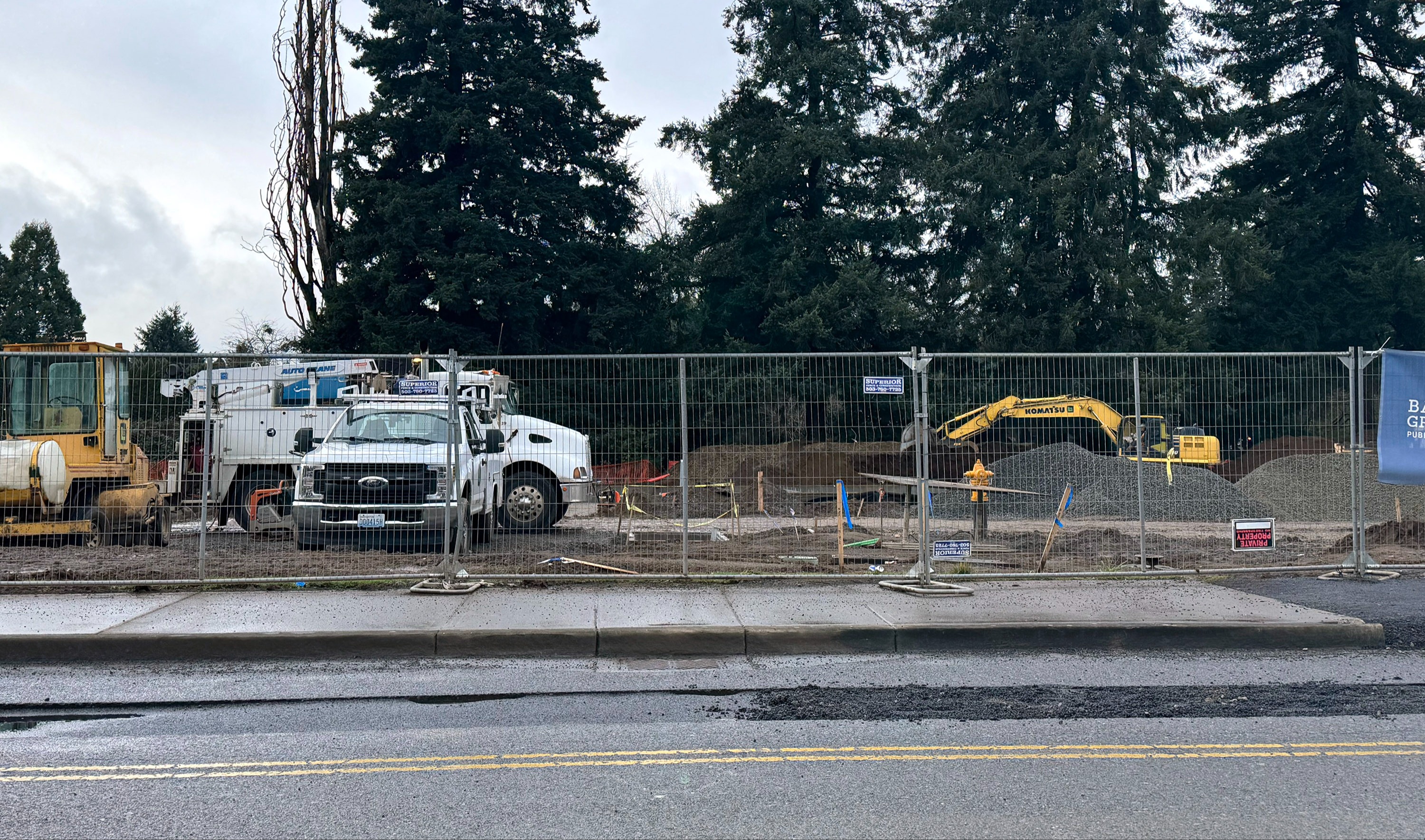 Heavy equipment prepares the footings for the modulars.