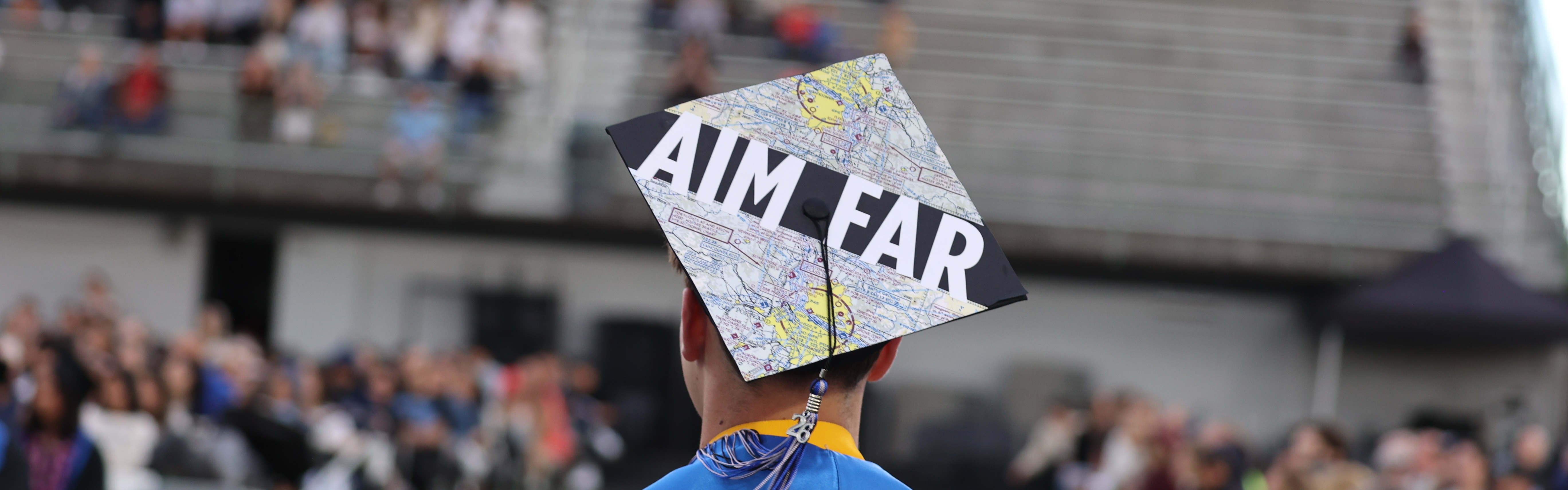 cap says 'aim far'