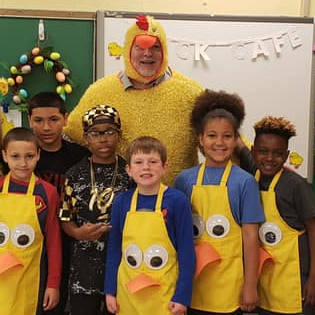 Students dress up as chickens with Dr. K