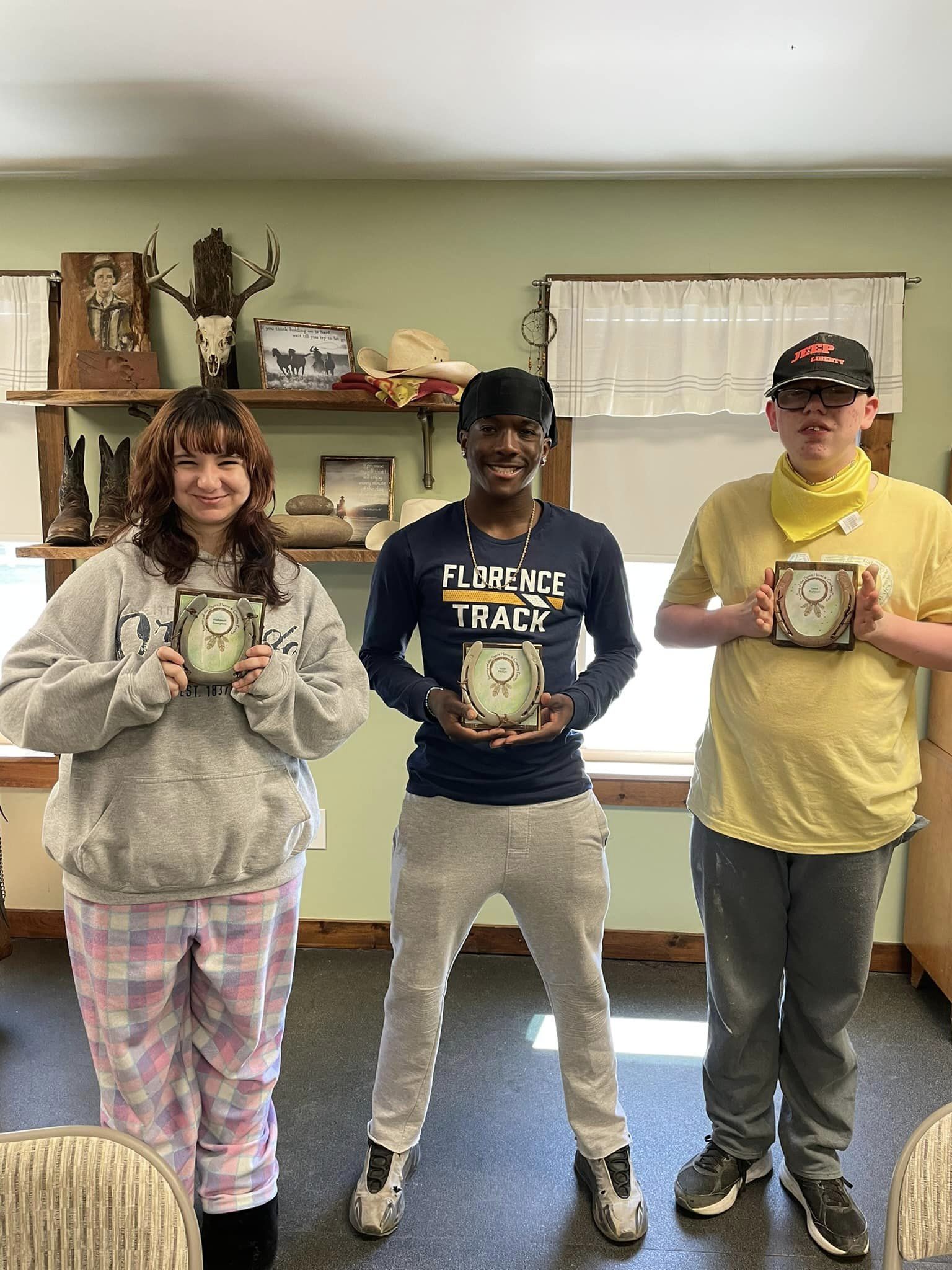 students showcasing the crafts they made