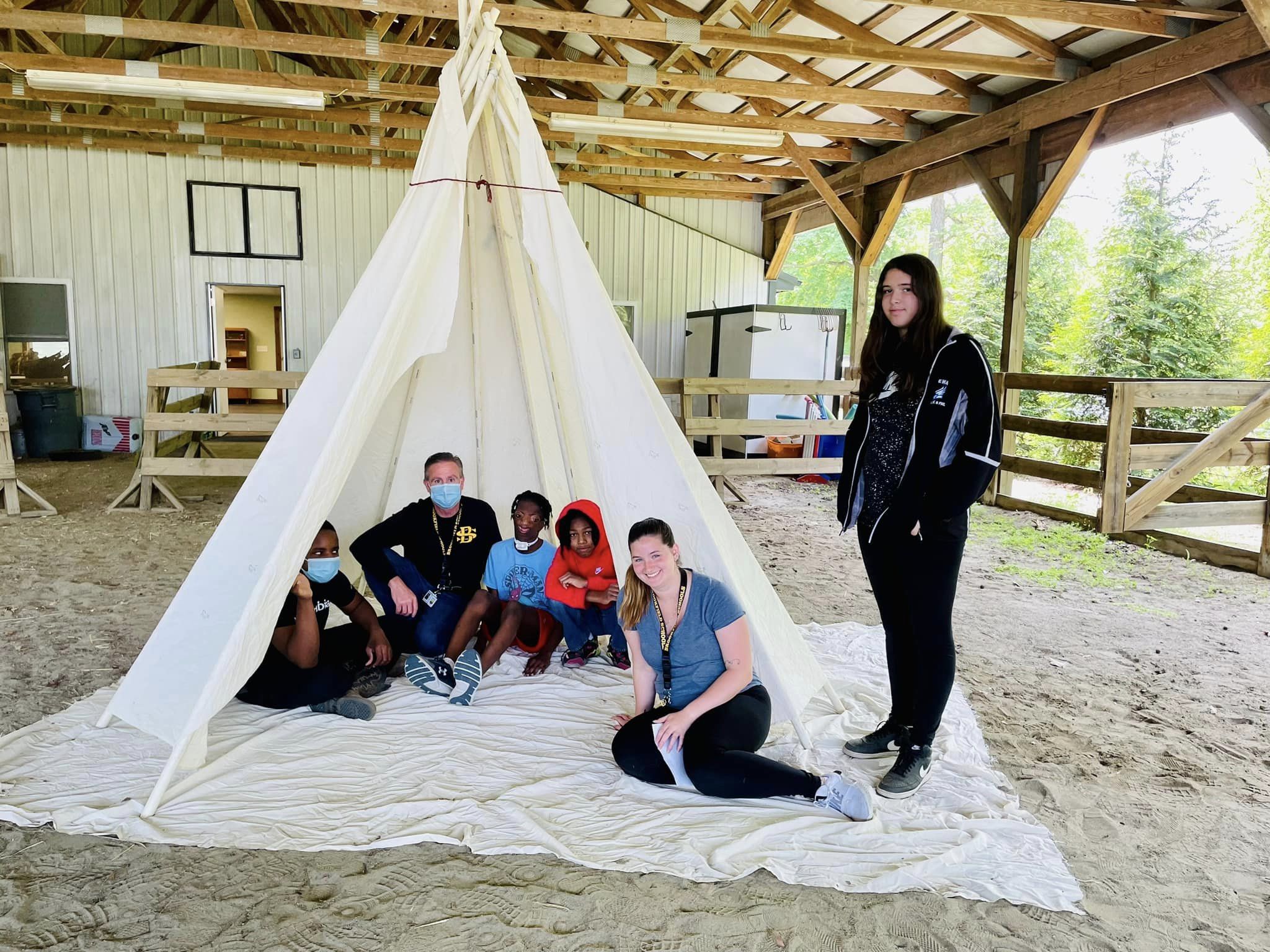 Students inside Tee-Pee