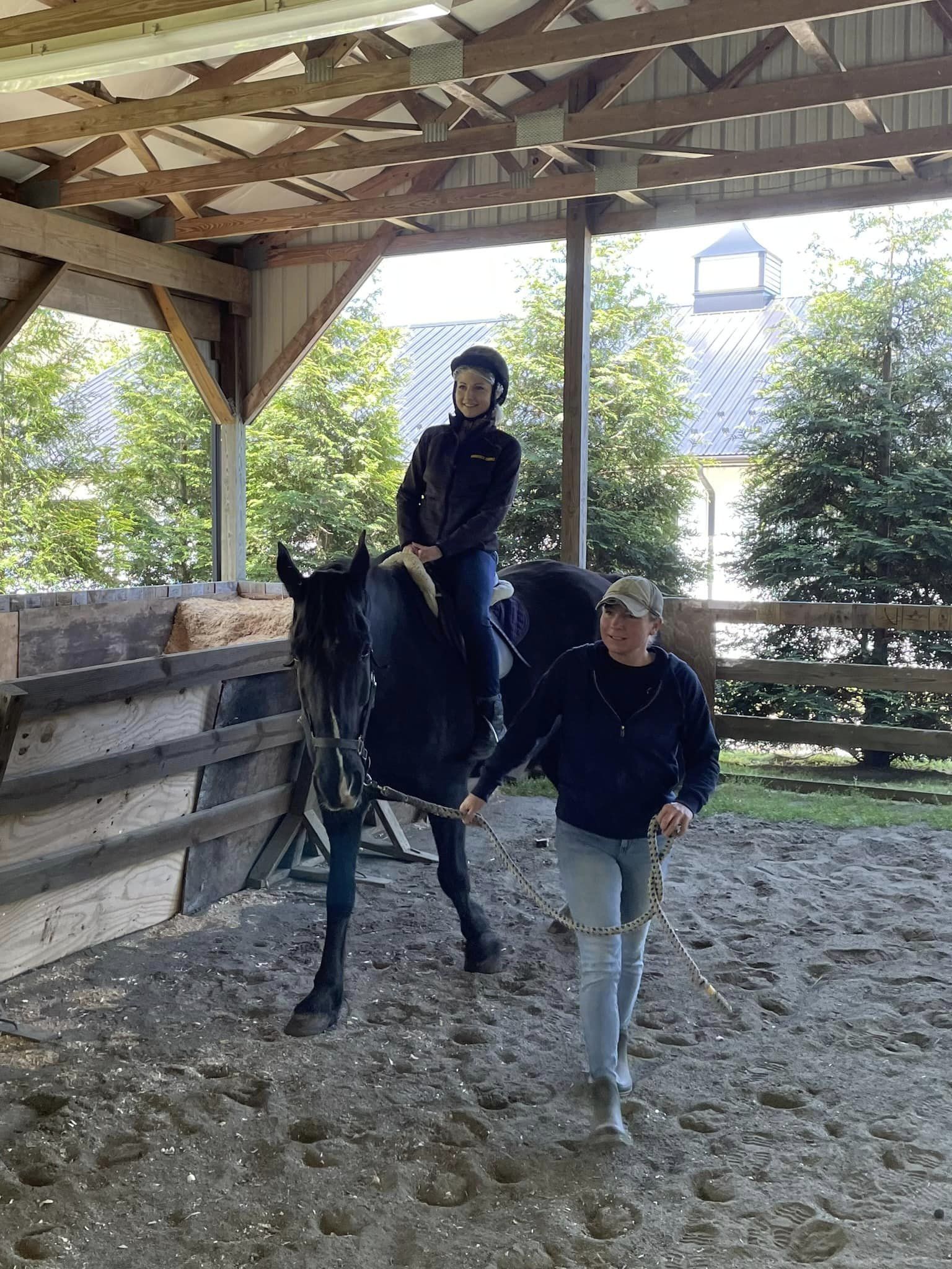 student riding horse