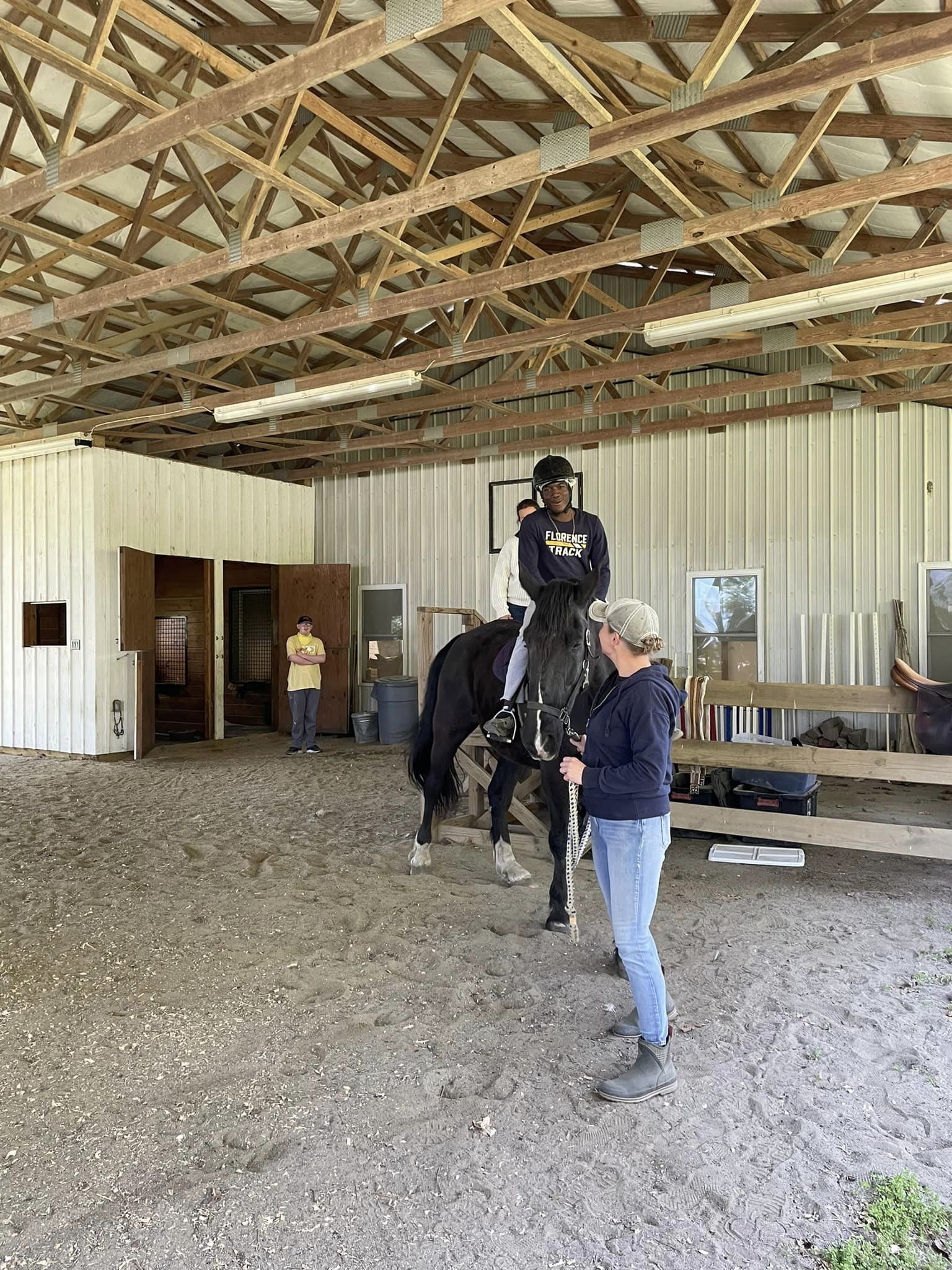 student riding horse