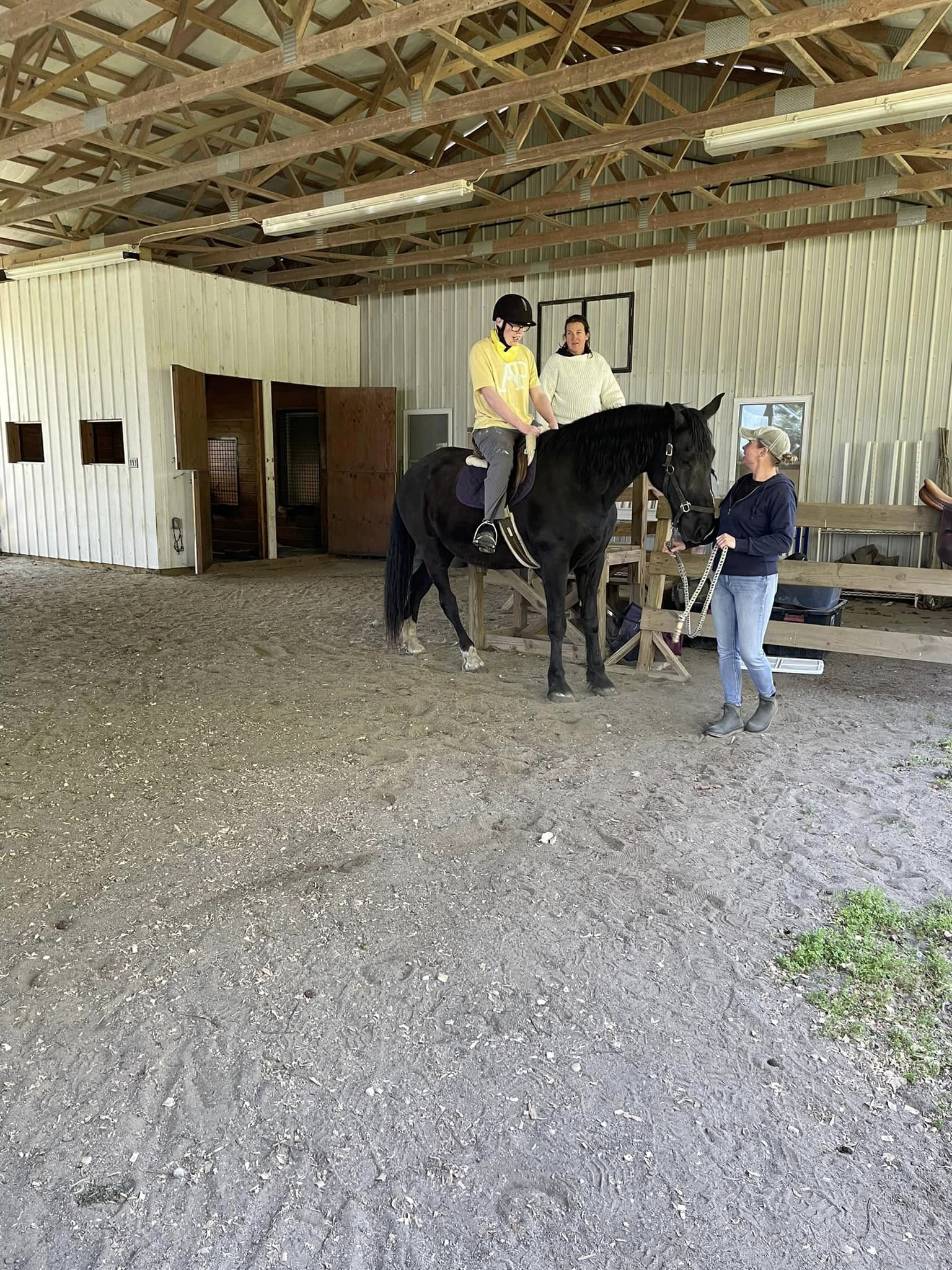 student riding horse