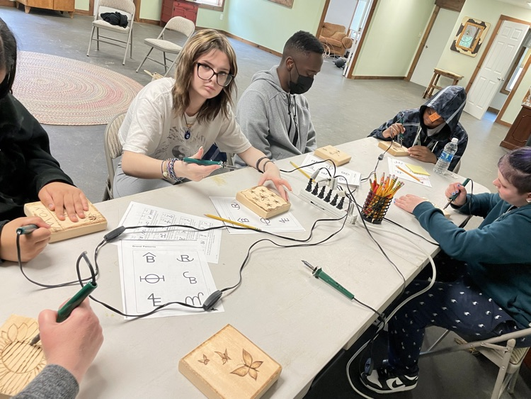 students working on craft projects