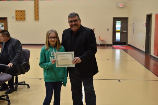 Students are honored at a Board Meeting for their essays in the Martin Luther King Jr. Essay Contest.