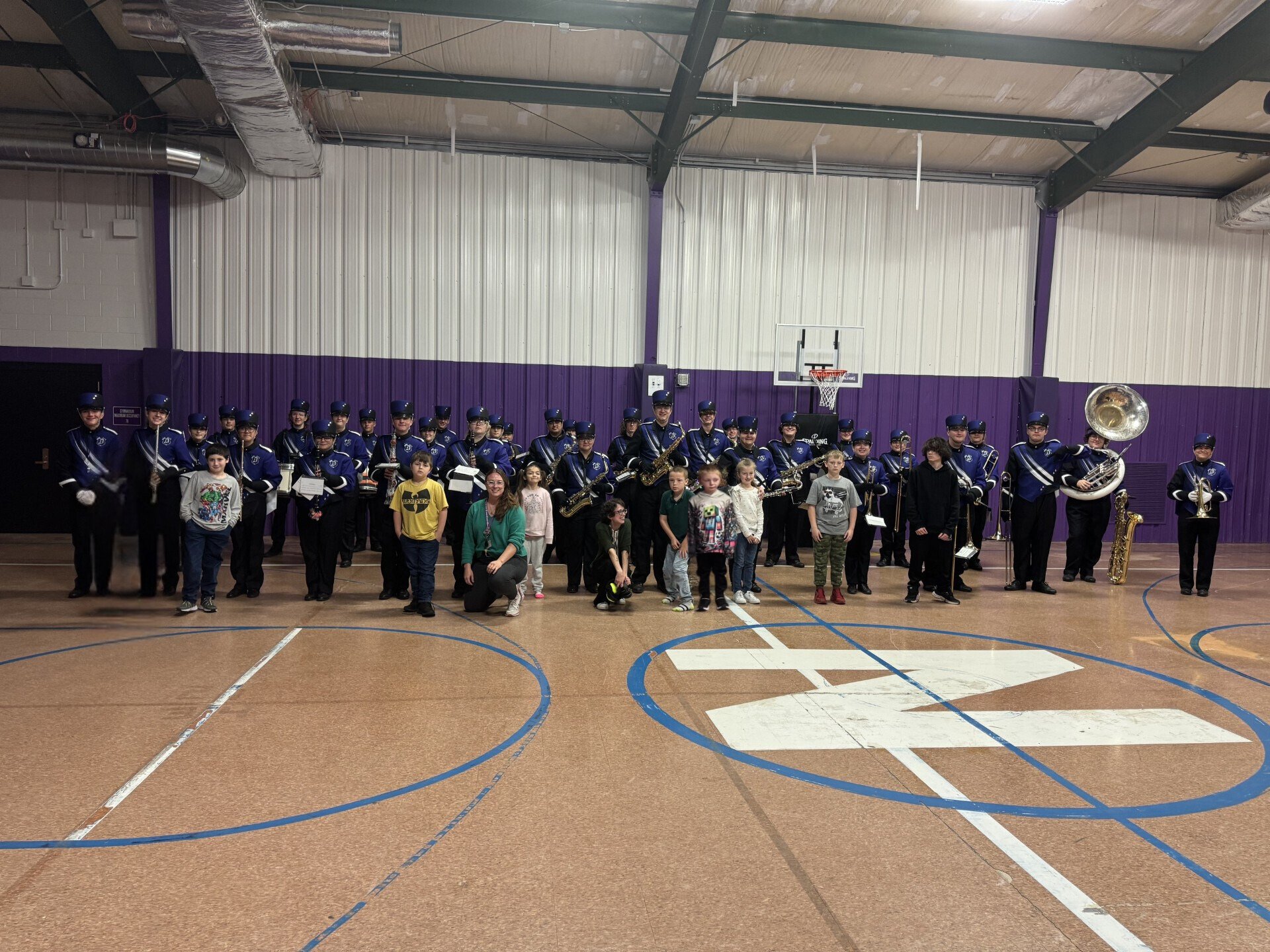 students posing for photo with dhs band members