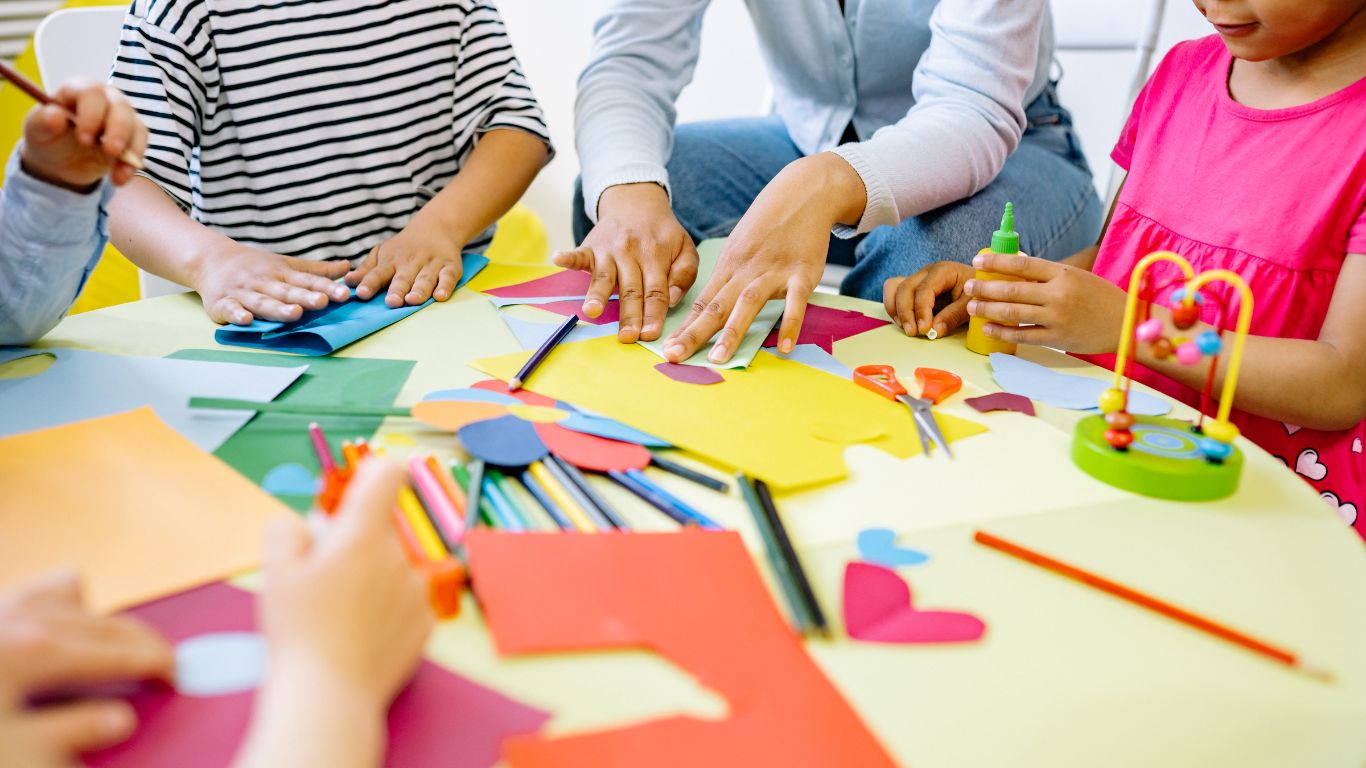 Children doing arts and crafts around a table