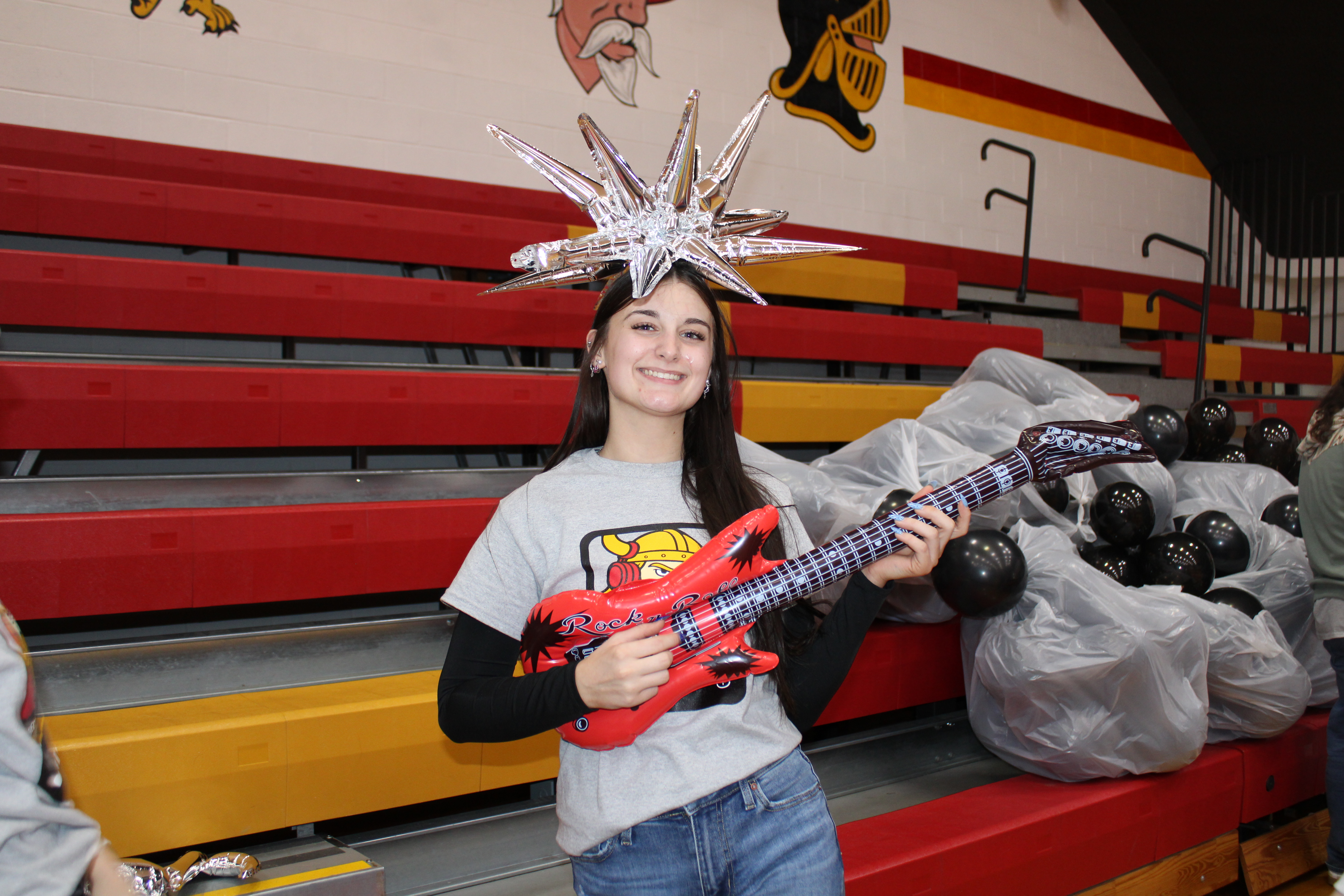 Student decorating with a silver star