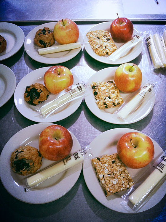 Apple and cookie in a plate