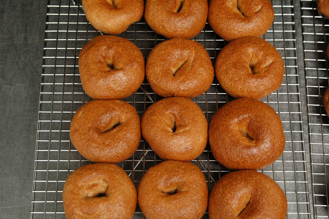 Bagels cooling on wire rack, ready to be enjoyed.