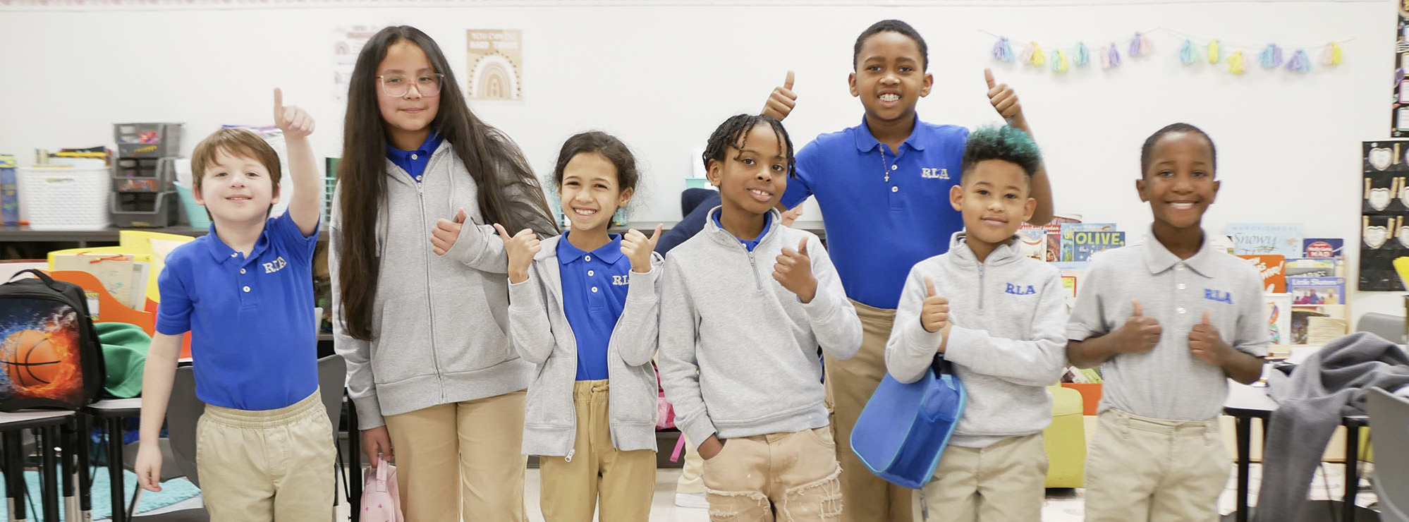 Students giving a thumbs up