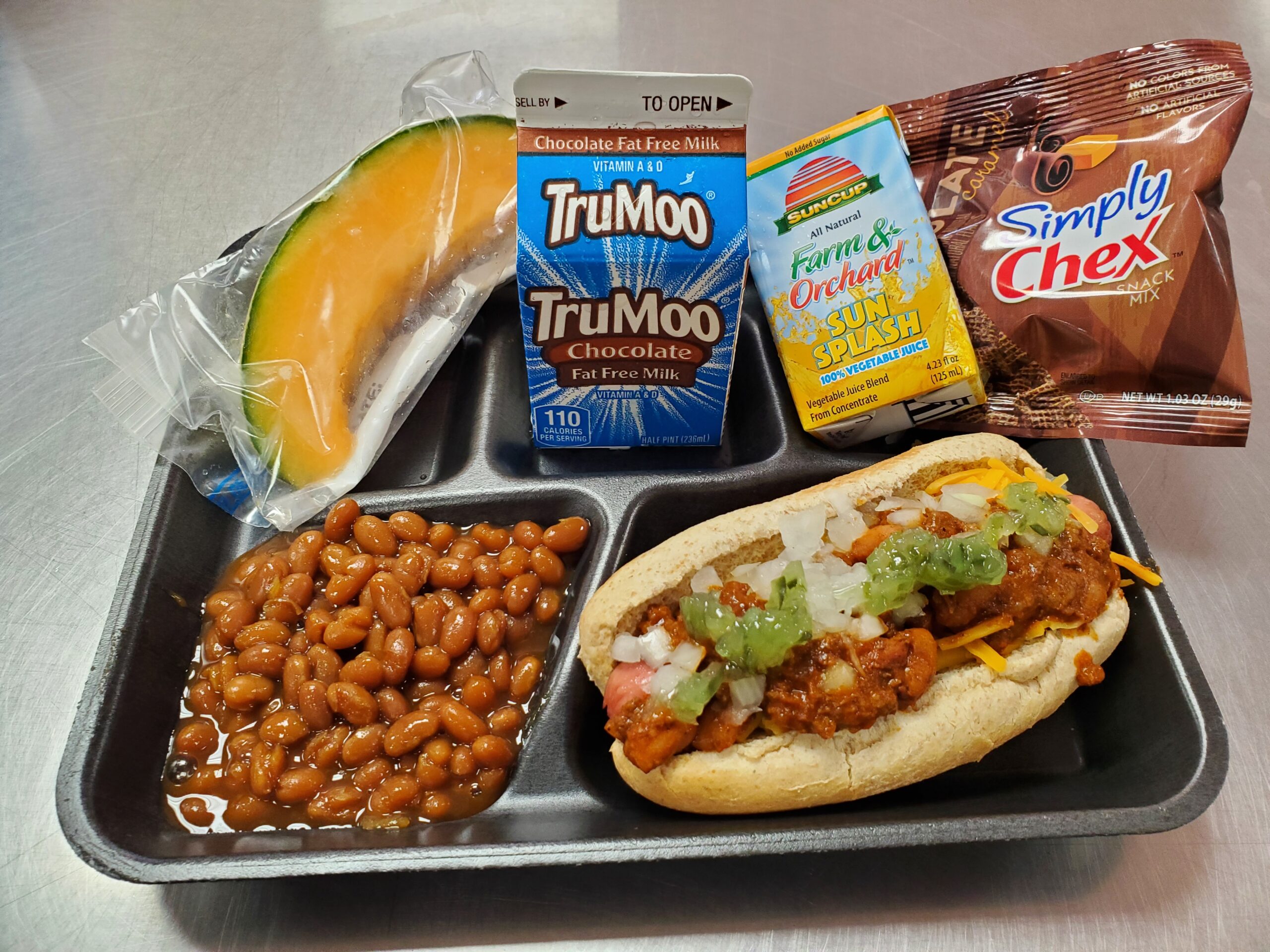 A metal tray topped with different types of food