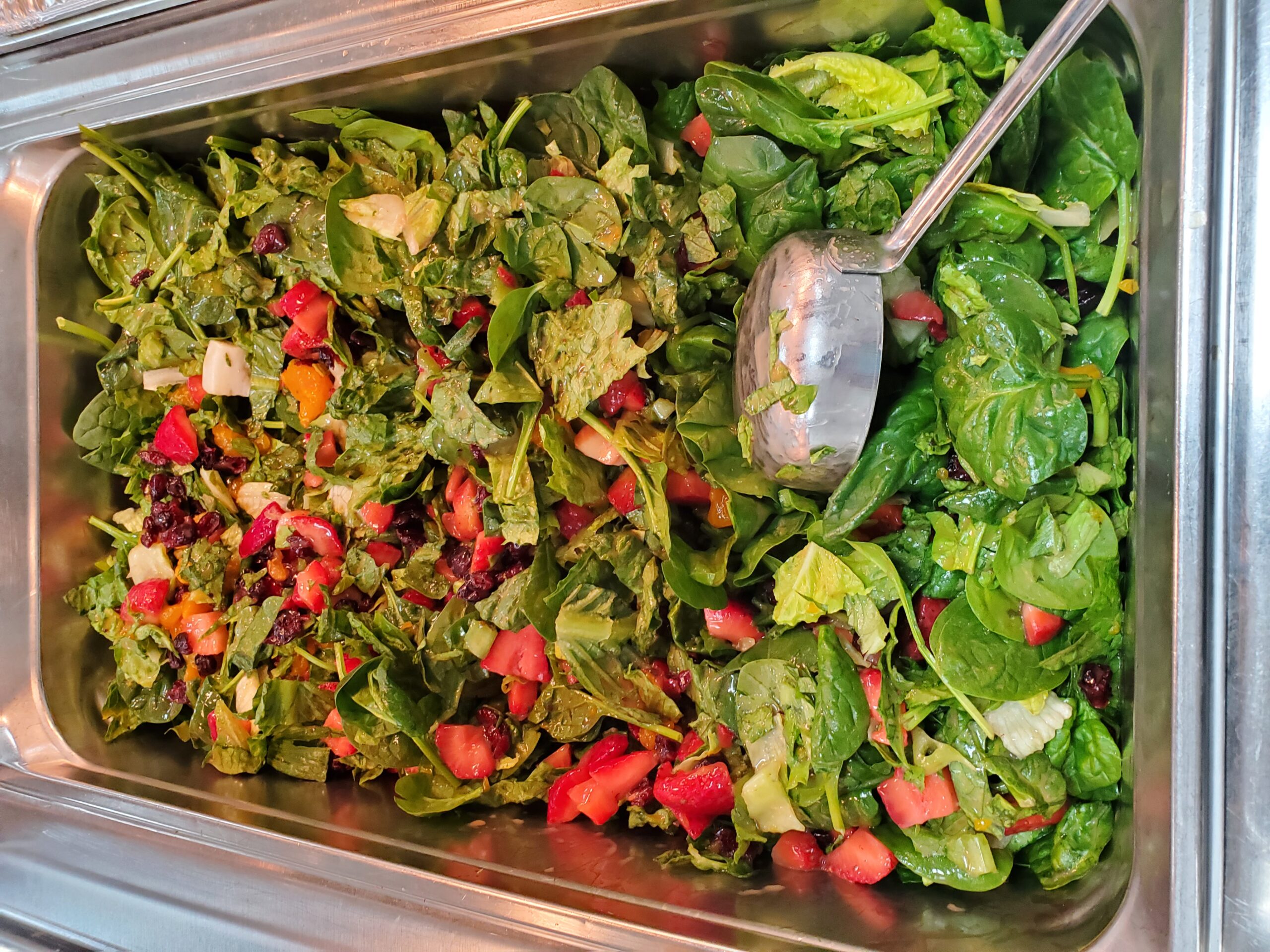 A metal tray topped with different types of food