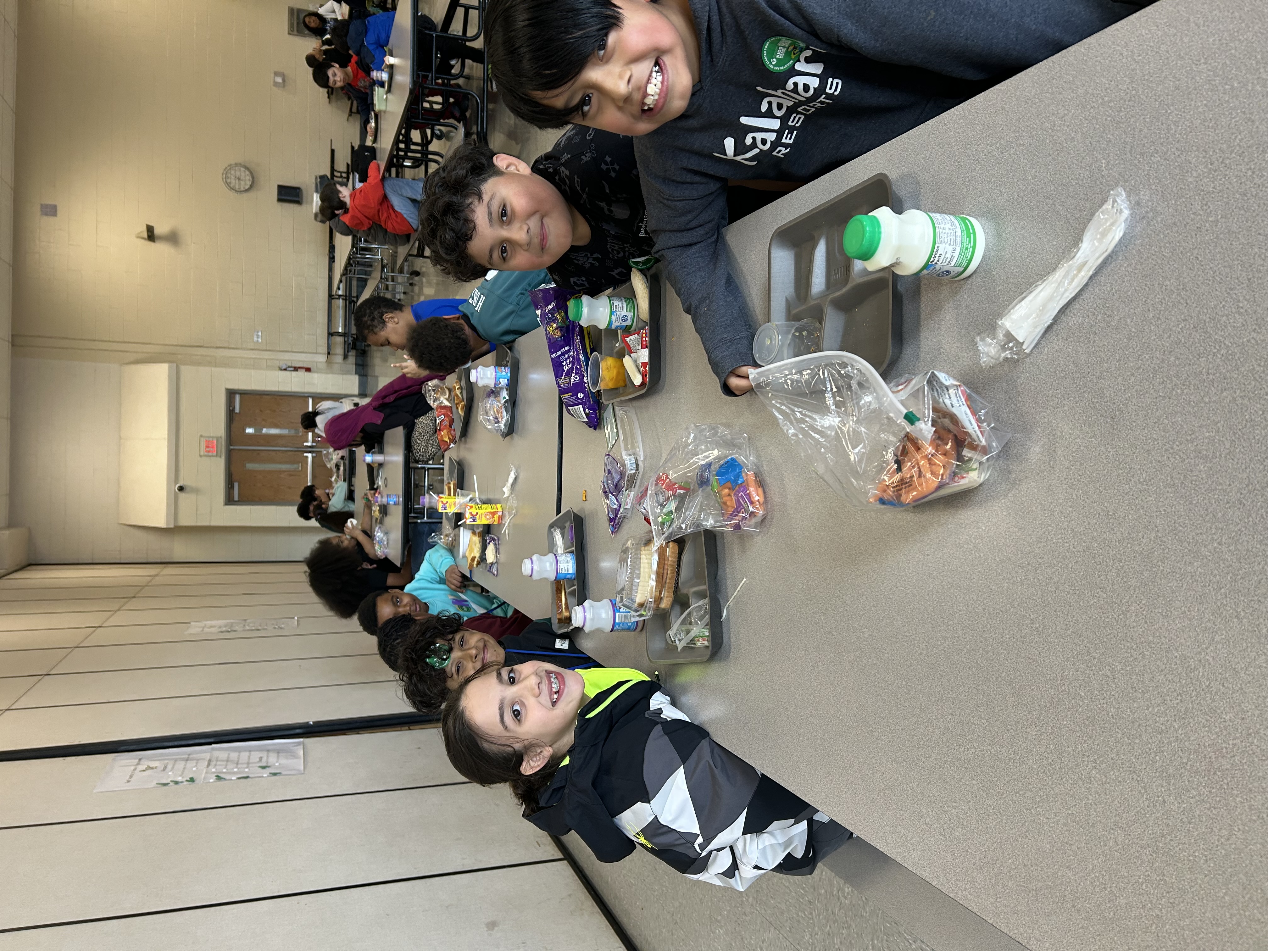 three kids eating lunch