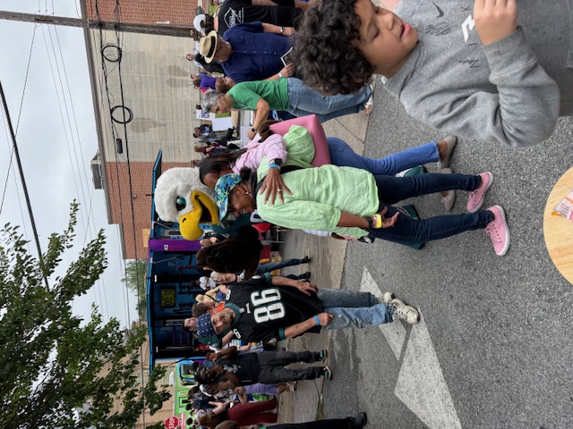 eagles mascot posing with friends at block party