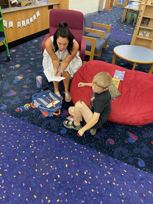 students and teachermaking handcrafts in the classroom