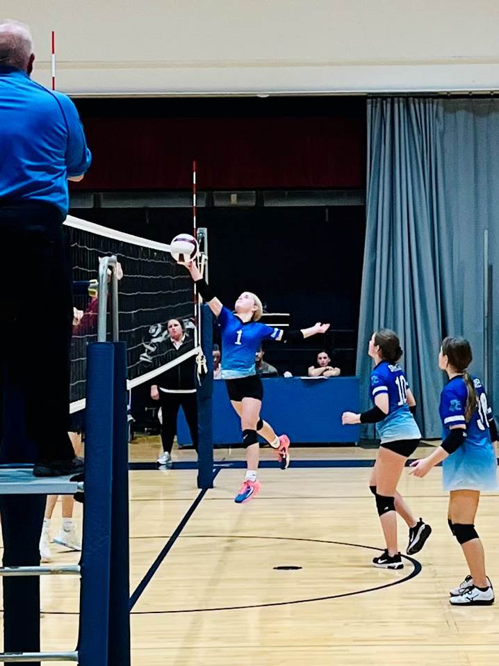  volleyball player jumping to get the ball