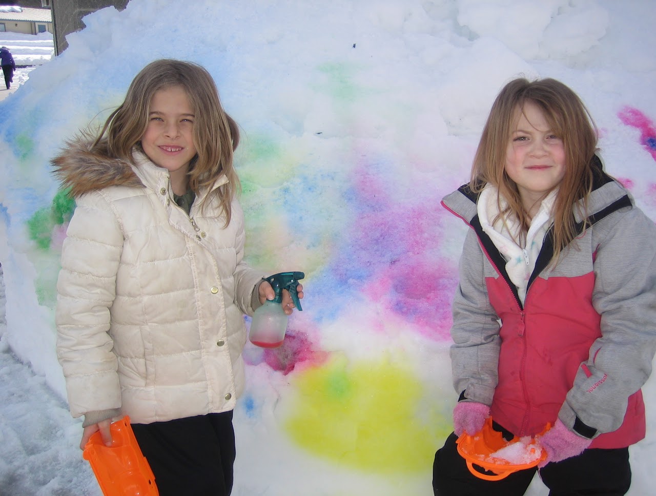 girls in winter smiling looking at camera