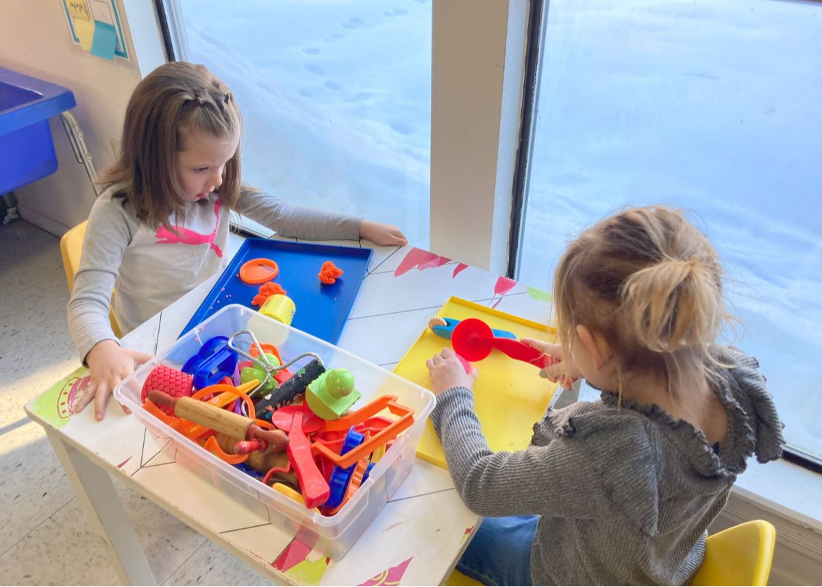 students playing at a table