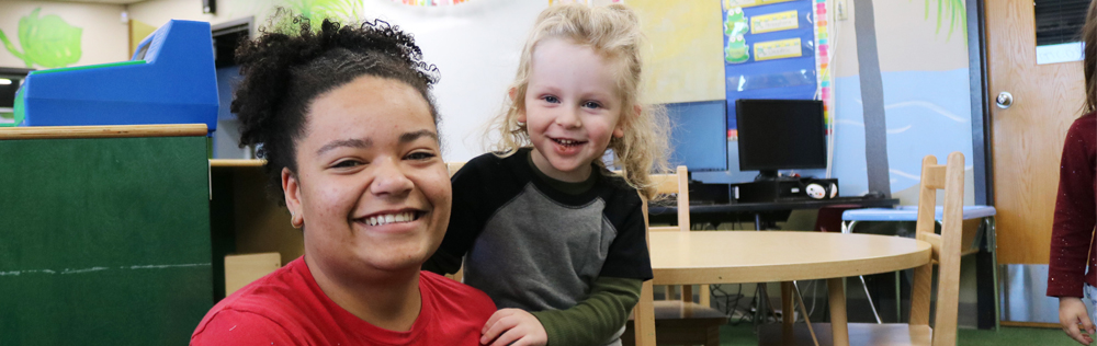 photo of Teacher Prep student with a child in the Children's Lab