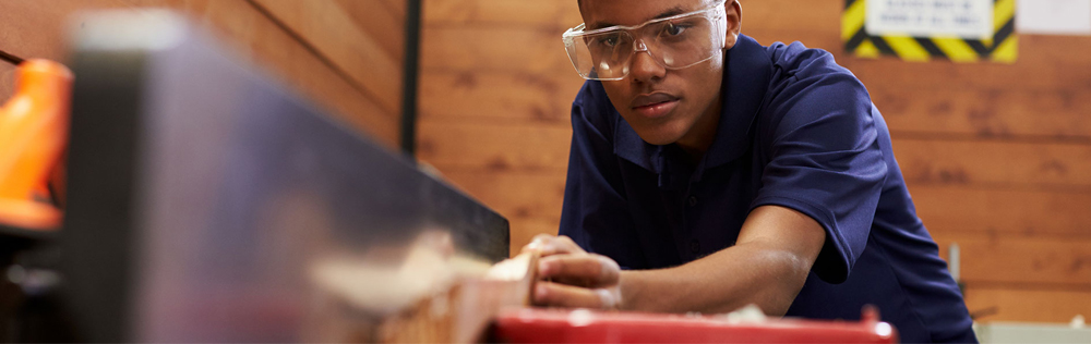 banner photo of student using a table saw