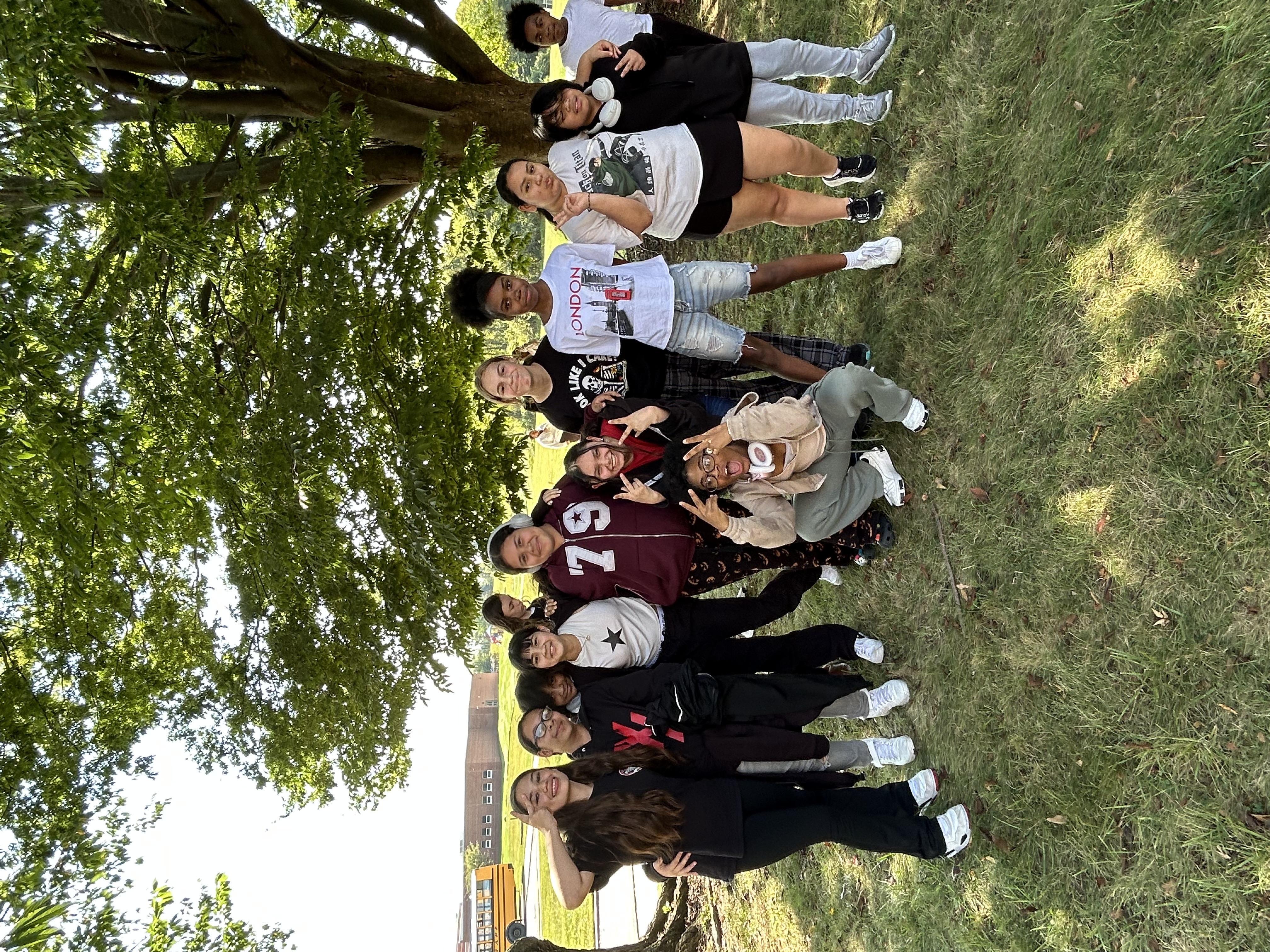 student gather for picture on nice day