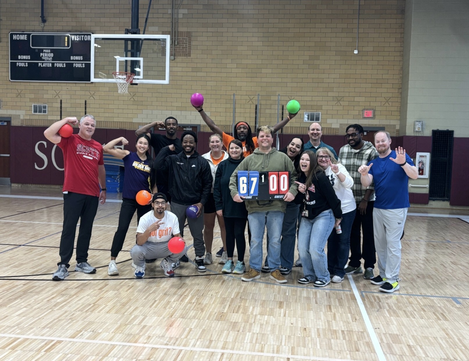 staff in gym posing for 67 picture