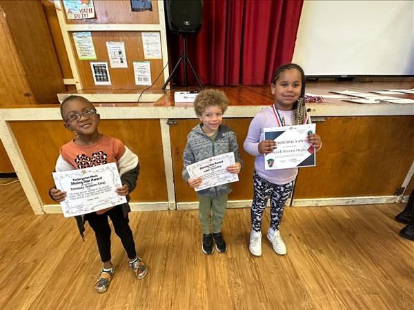 Three children posing for a photo