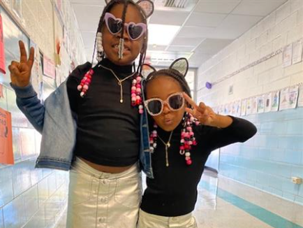 Two children posing for a photo