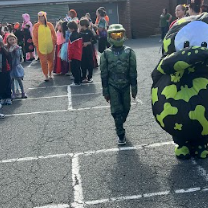 Kids in costumes standing in a row.