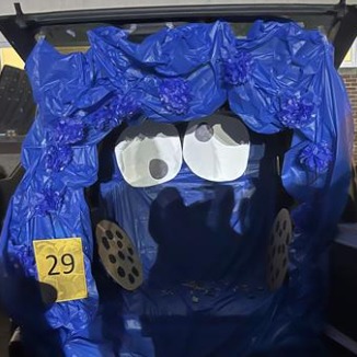 Blue and yellow costume with a face on it.