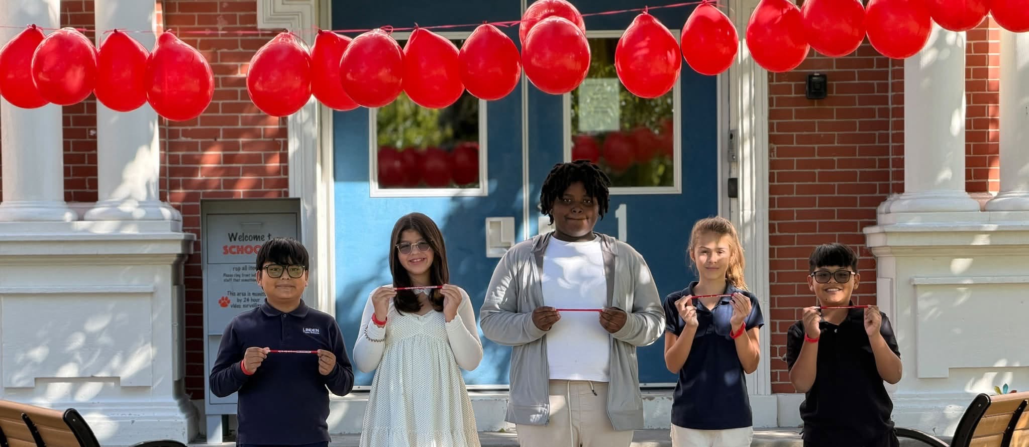 picture of students with red ribbons