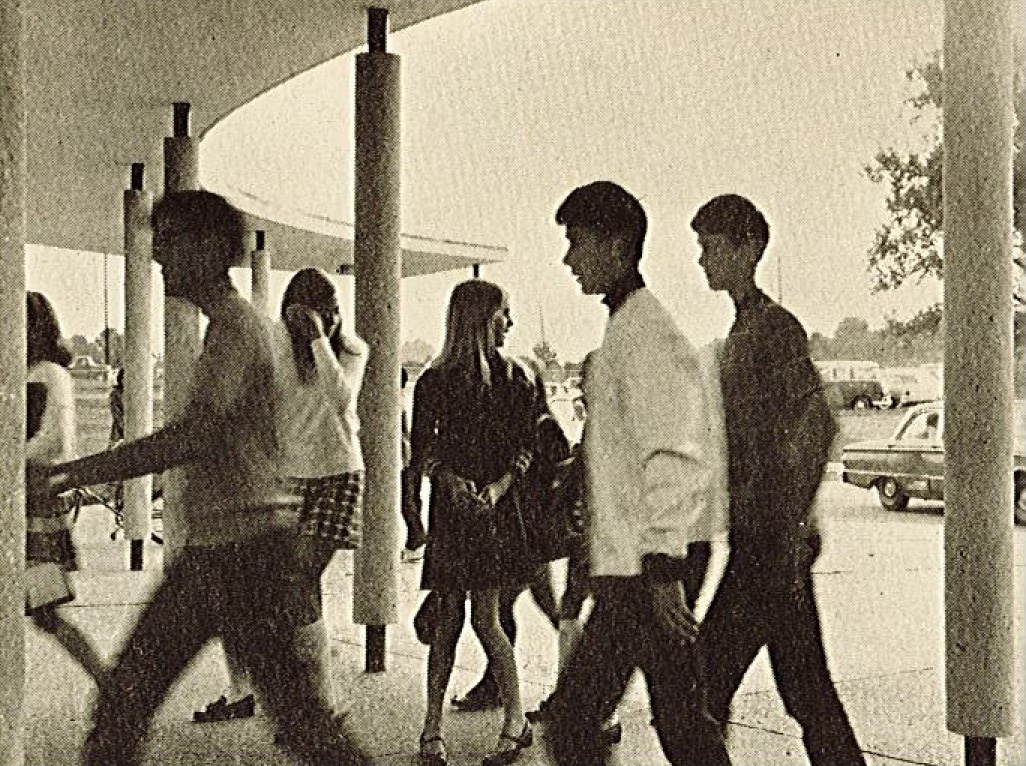 Newspaper scan - students walk into the old entrance to the school