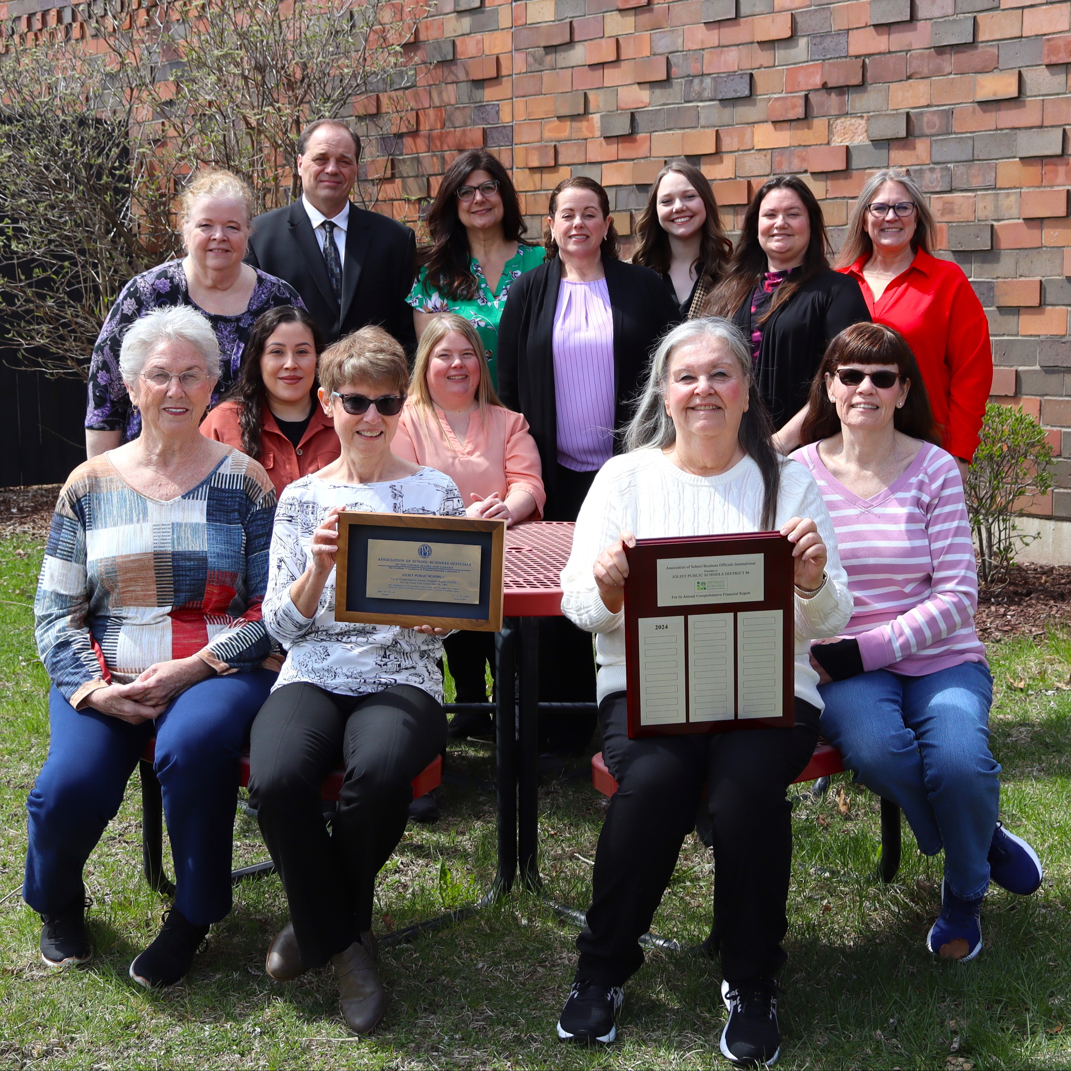 Picture of Superintendent with the Business Office employees and four retired staff
