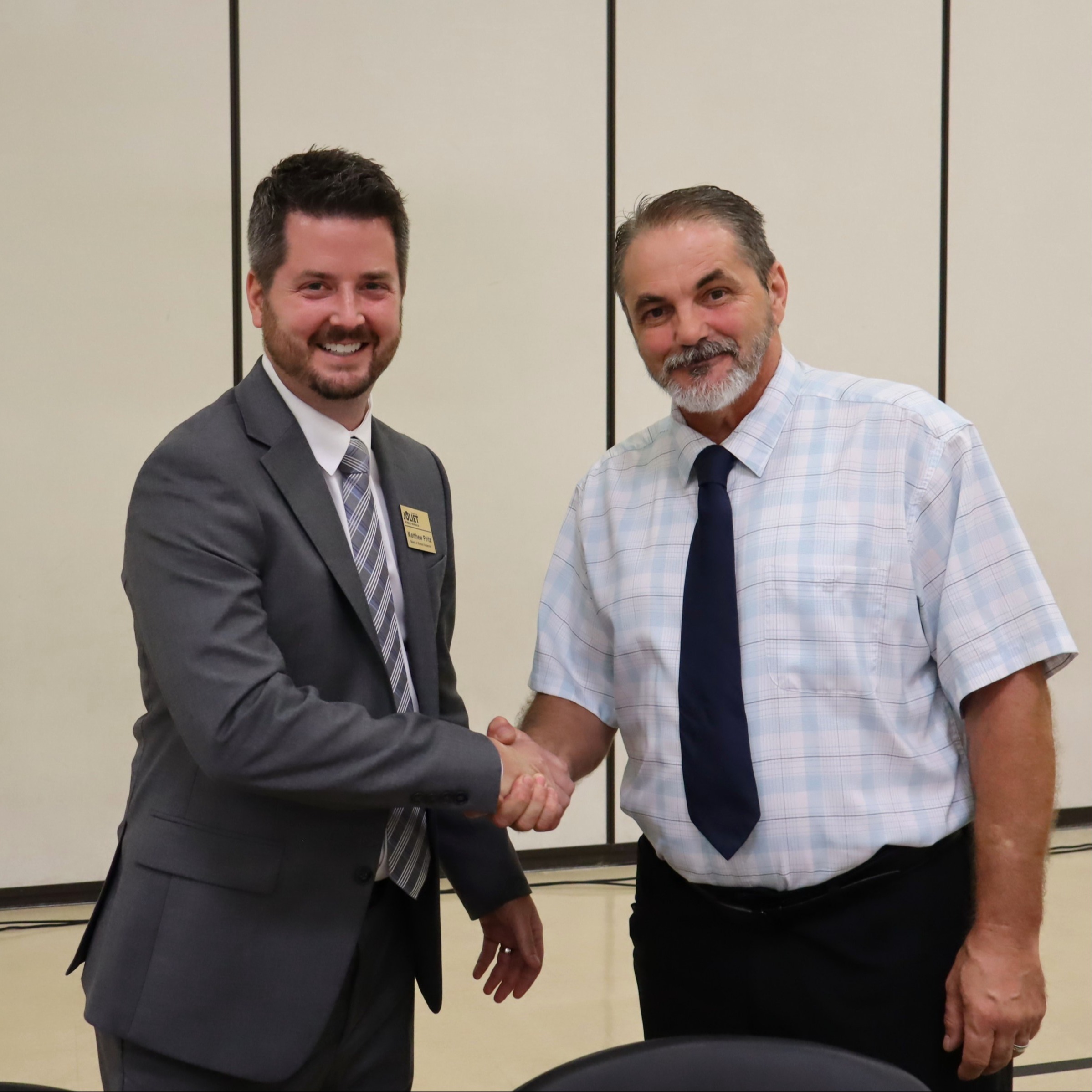 School Board President Matthew Pritz welcomes new school board member Andrew Smith