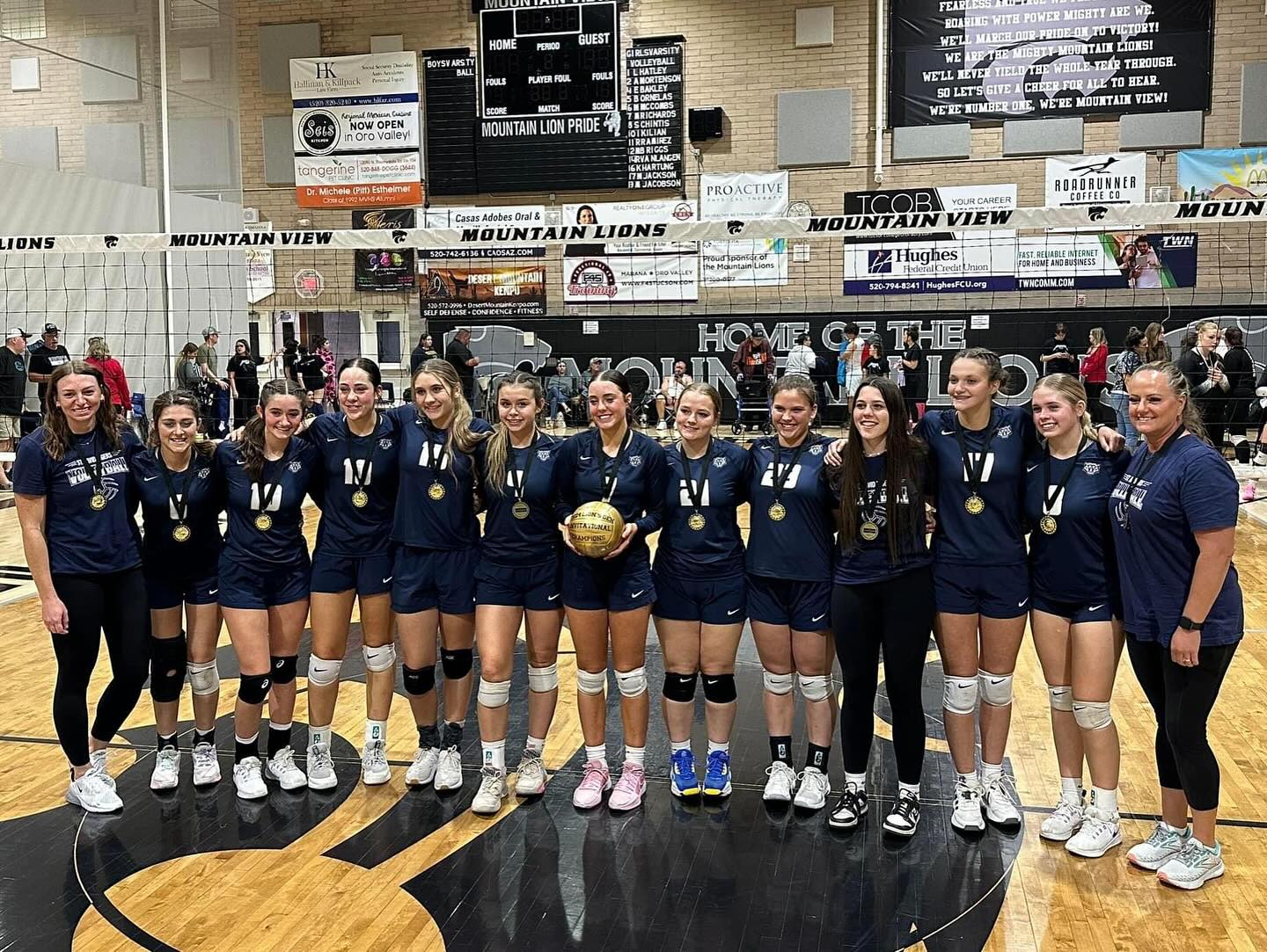 Volleyball team wearing medals