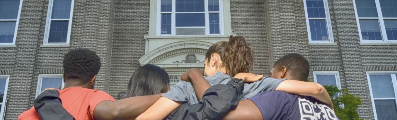 students hugging