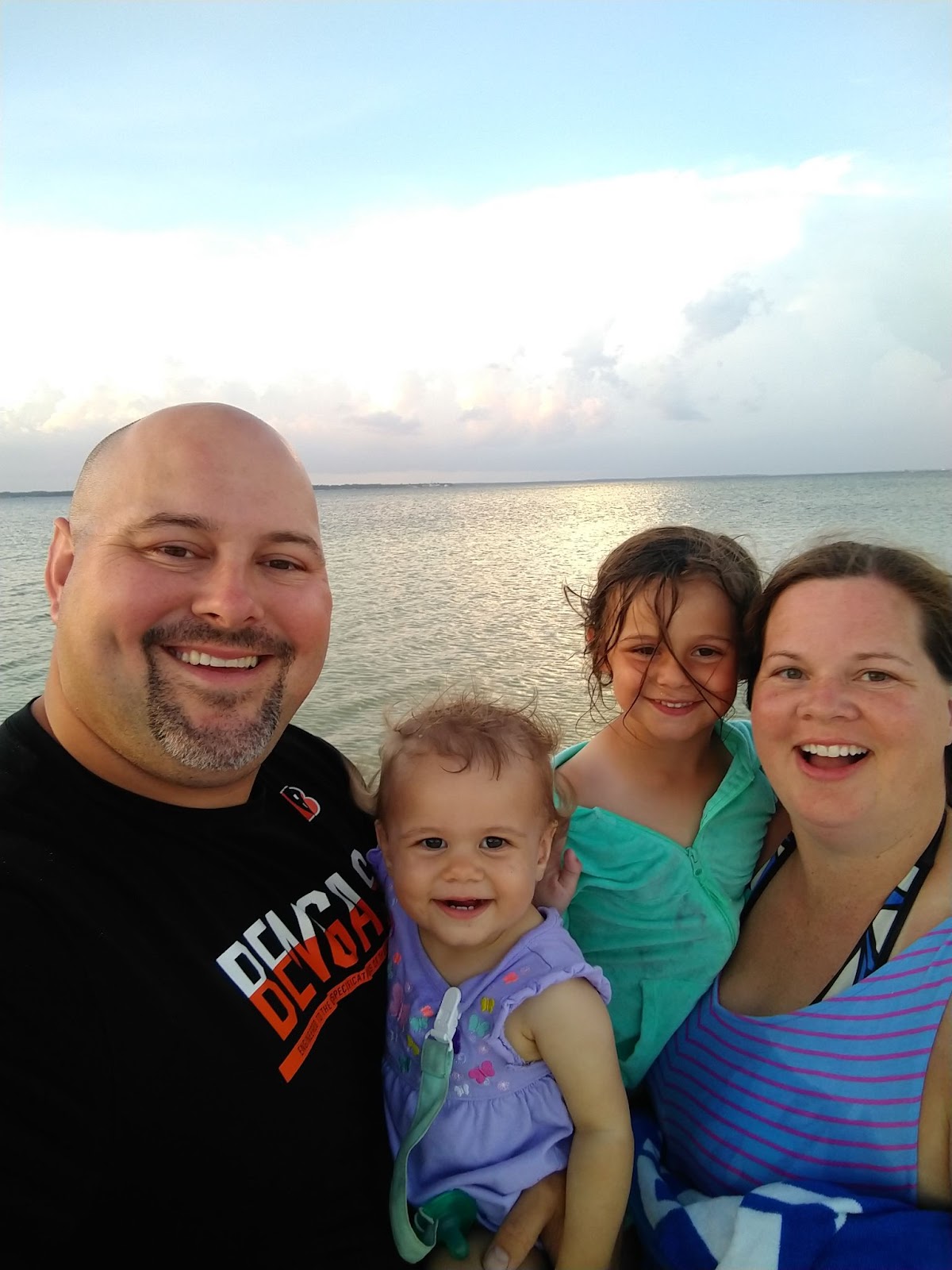 Mr. Owens at the beach with his children Riley 2, Kennedy 5, and wife Erin 