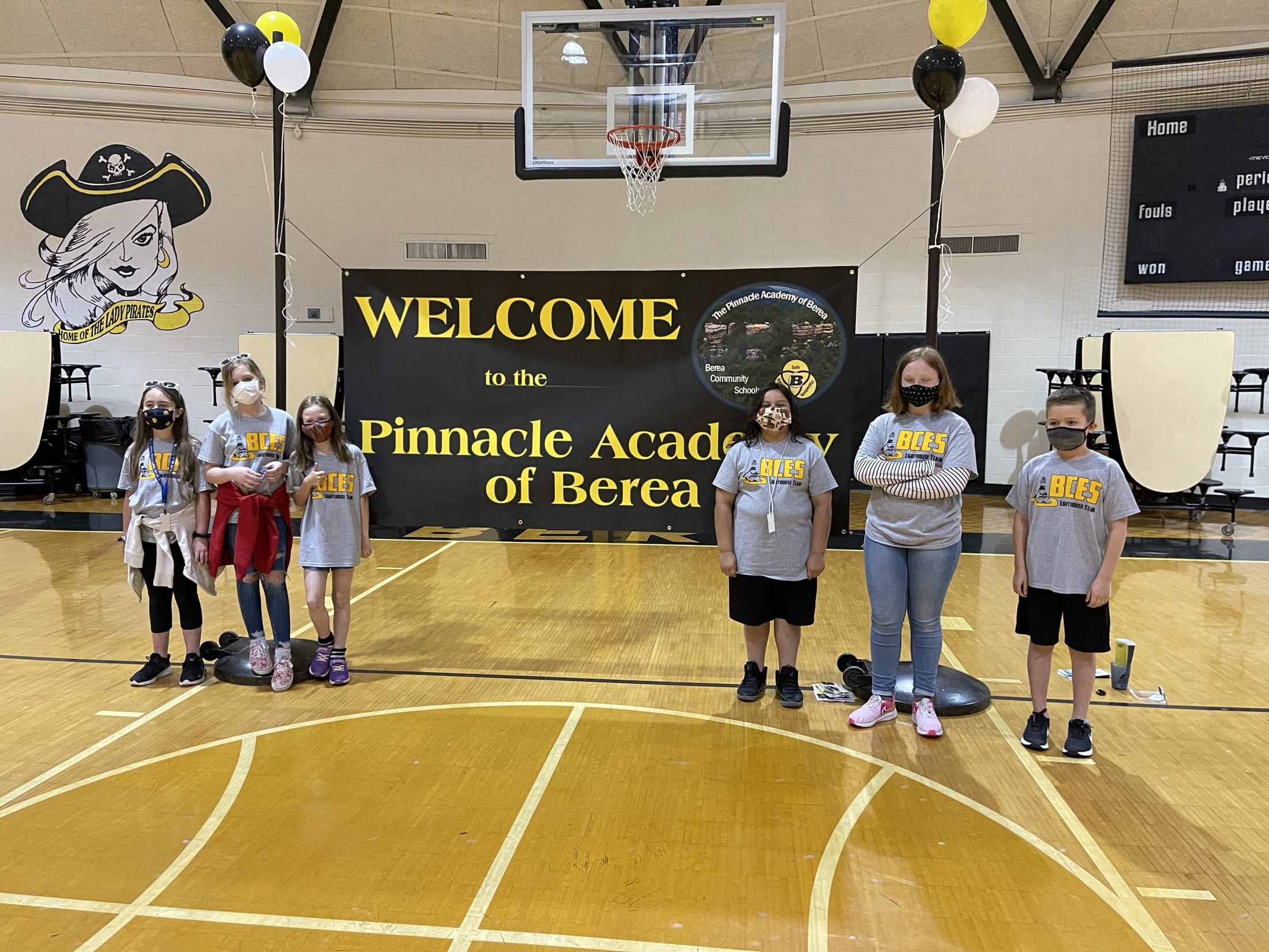 Teacher on a stand Welcoming  to The Pinnacle Academy of Berea 