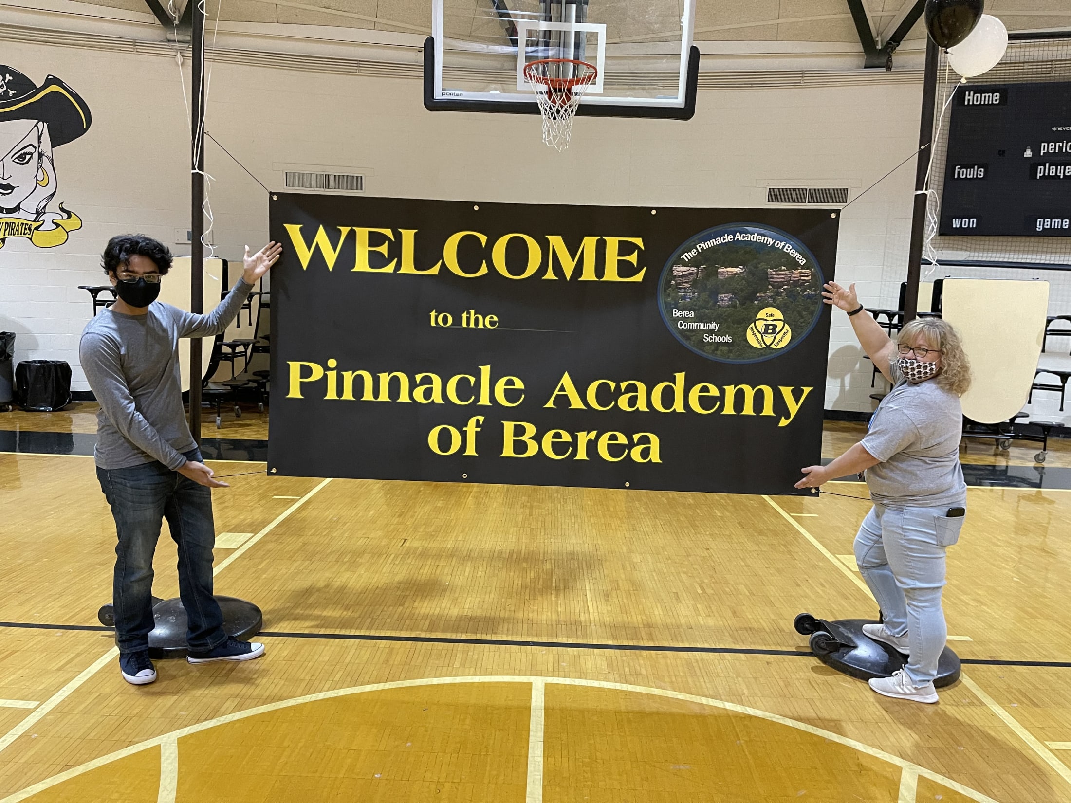 Teacher on a stand Welcoming  to The Pinnacle Academy of Berea 