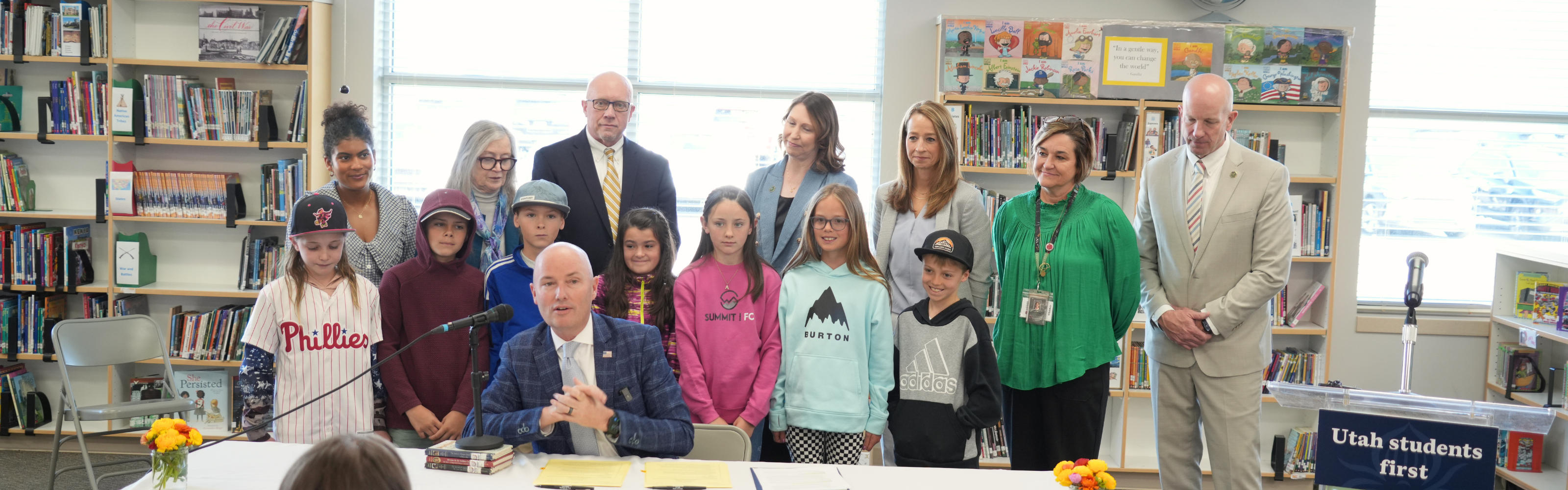Governor Cox signing bills with students