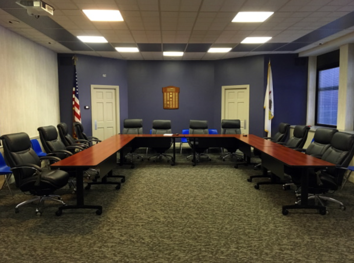 School Board room full of chairs and tables 