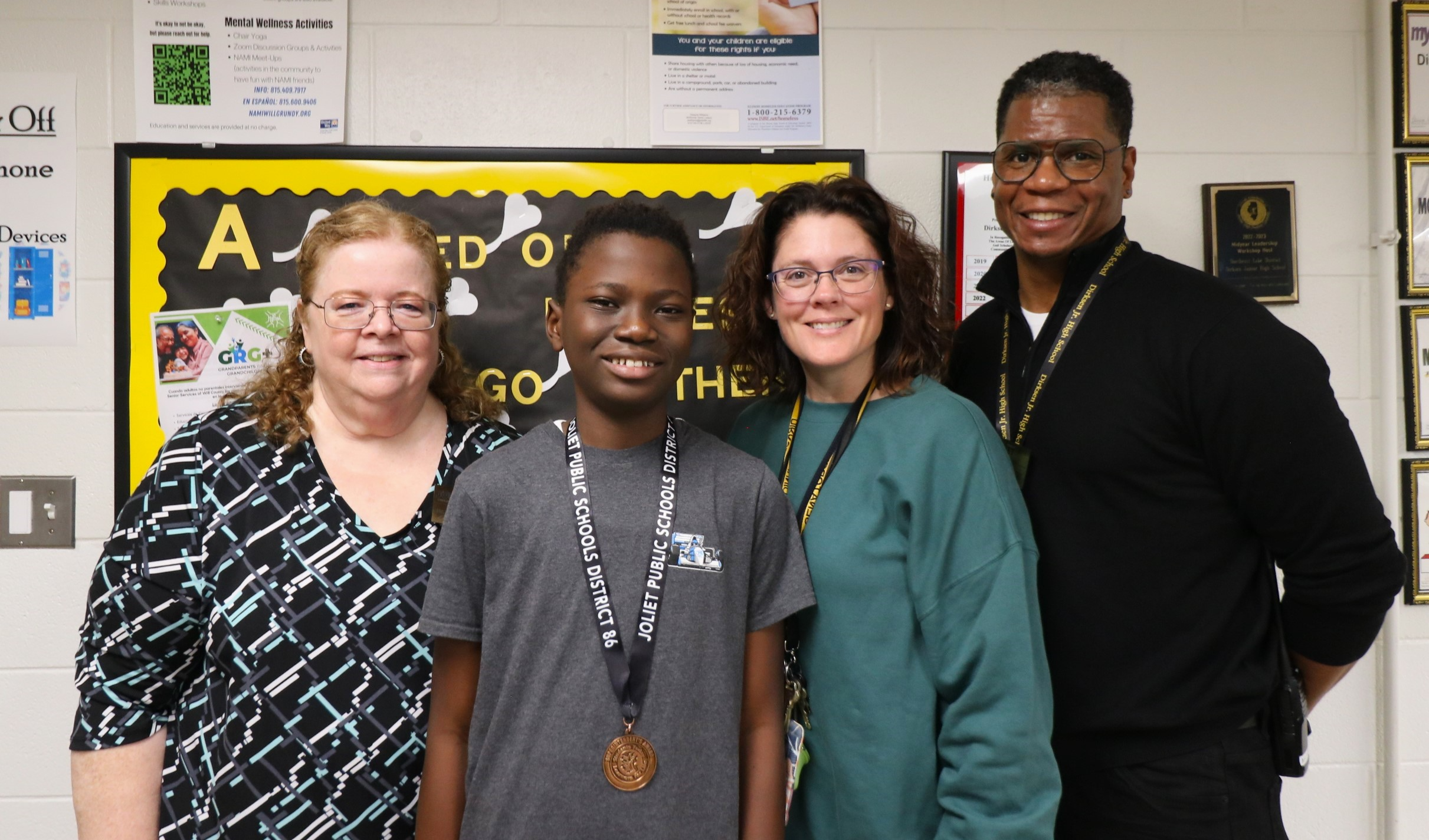 Superintendent, Principal, and academic advisor with student award winner
