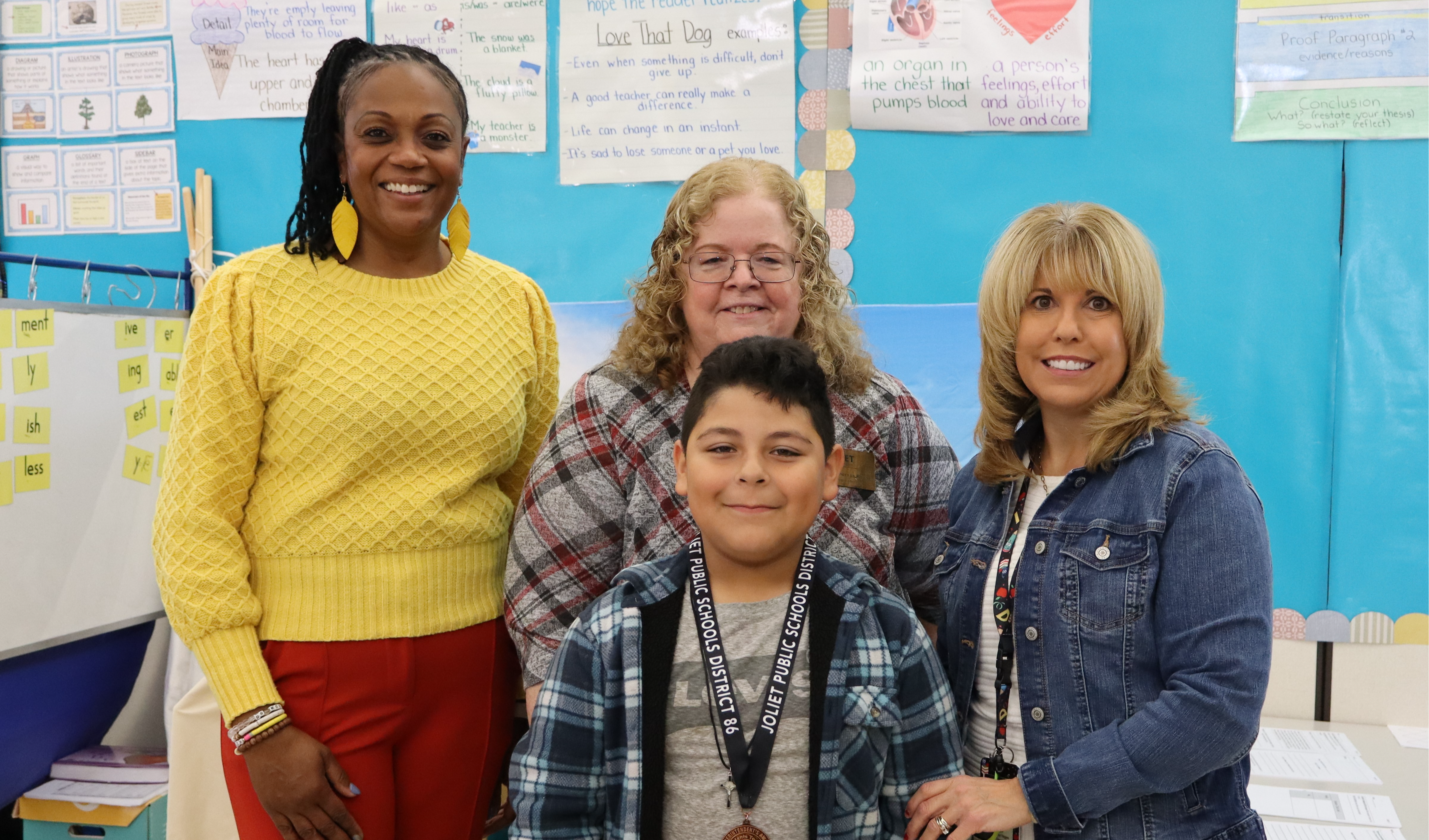 Superintendent, Principal, and teacher with student award winner