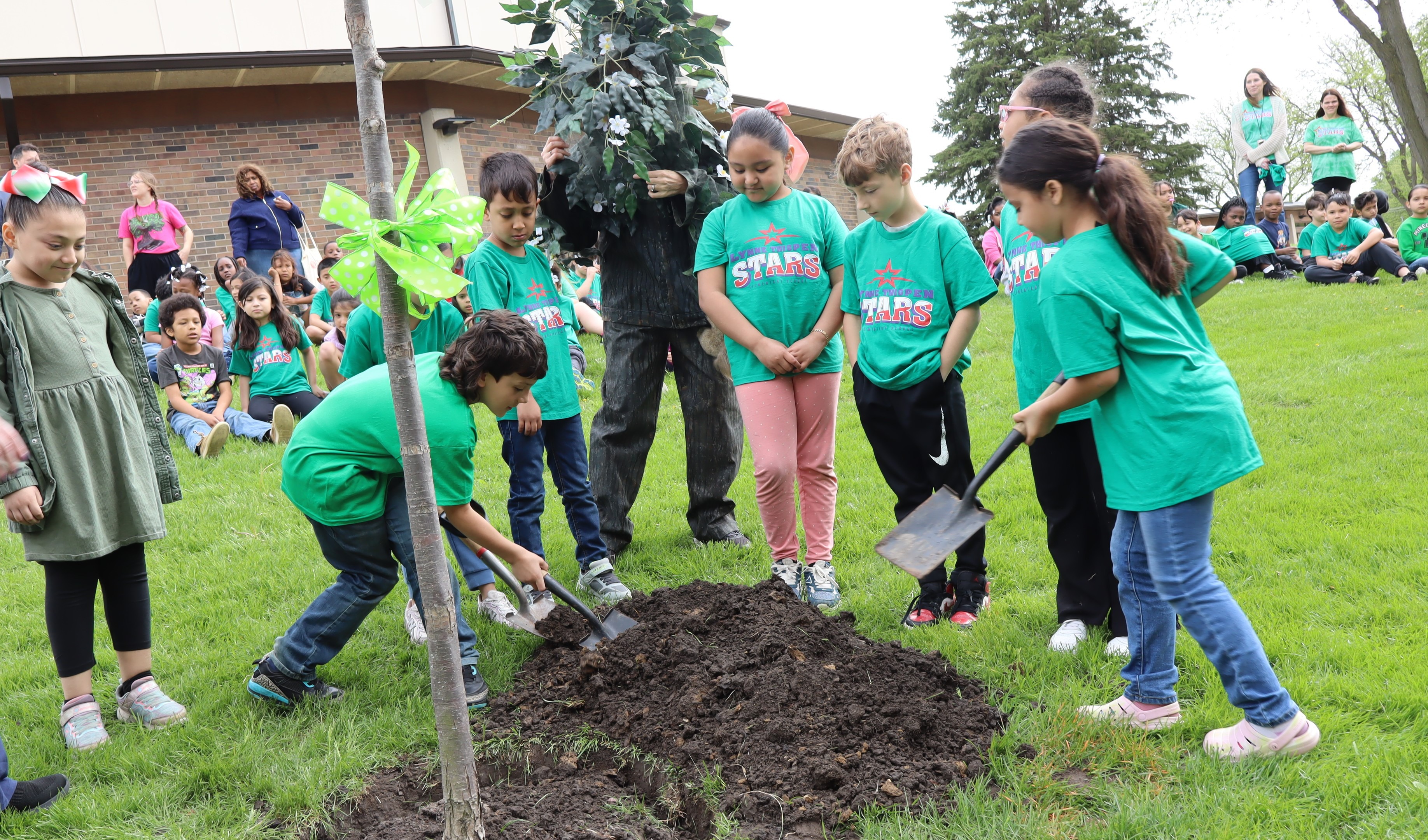 Students planting tree for Arbor Day