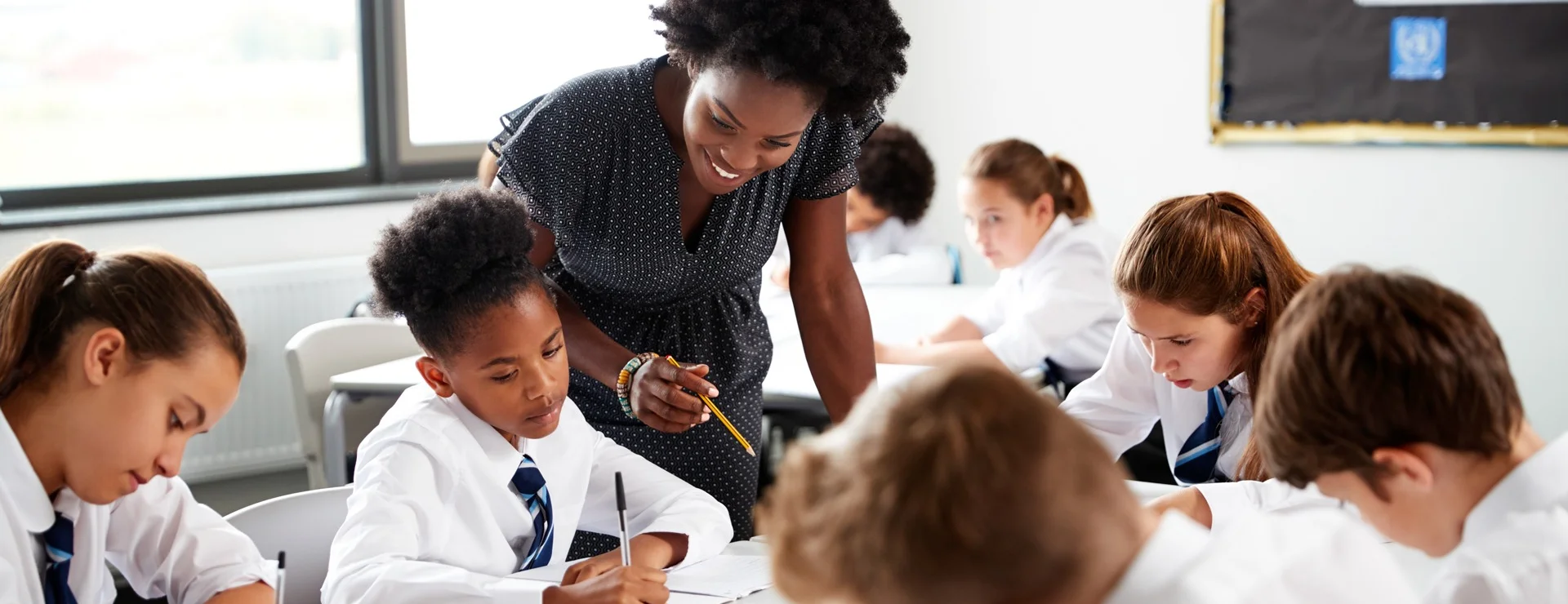 Teacher helping student